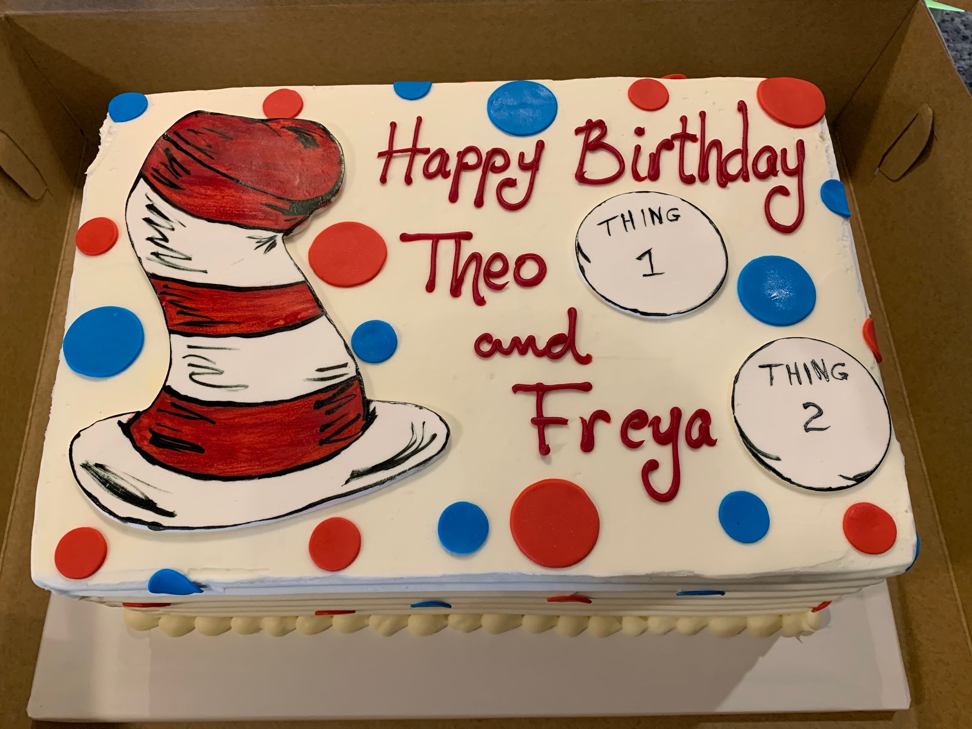 a birthday cake with a cat in the hat on it