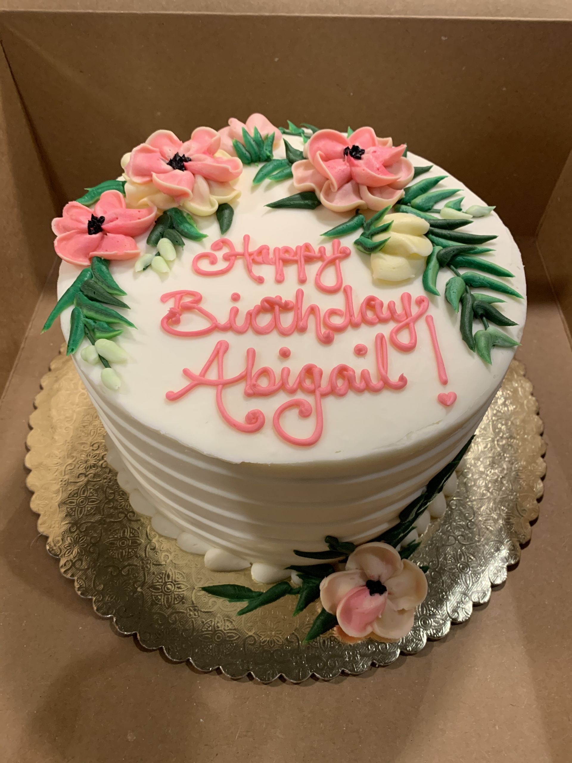 a birthday cake that says happy birthday abigail on it