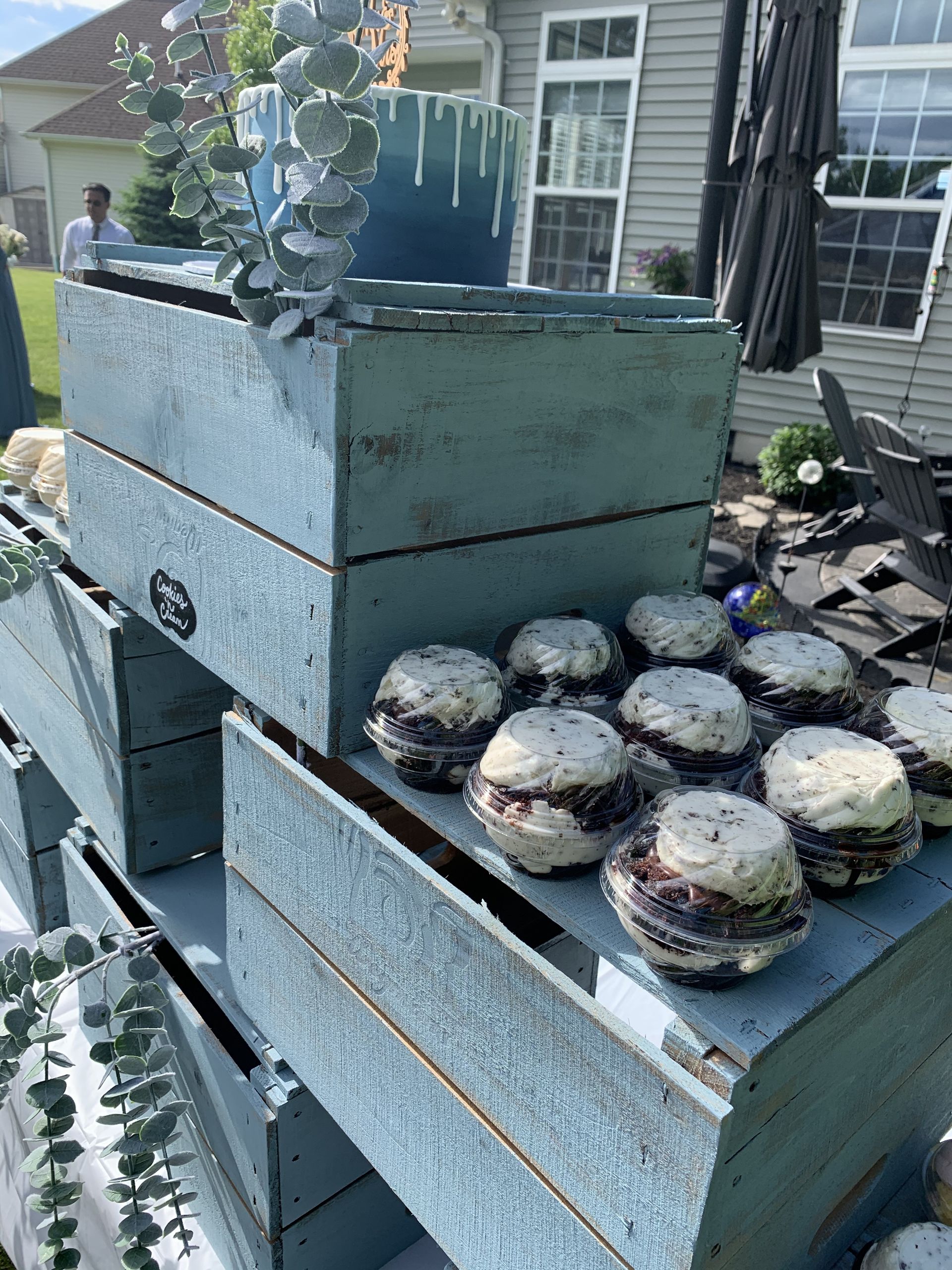 a bunch of cupcakes are sitting on top of each other on a table .