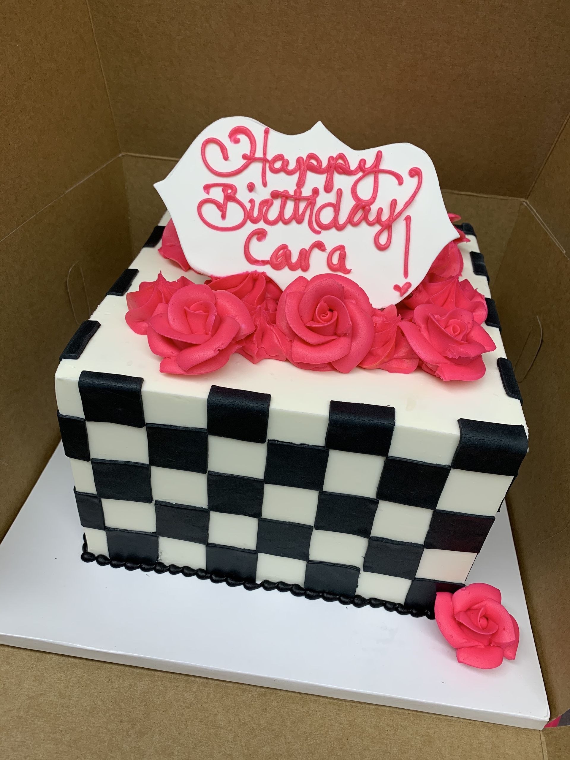 a black and white checkered birthday cake for cara