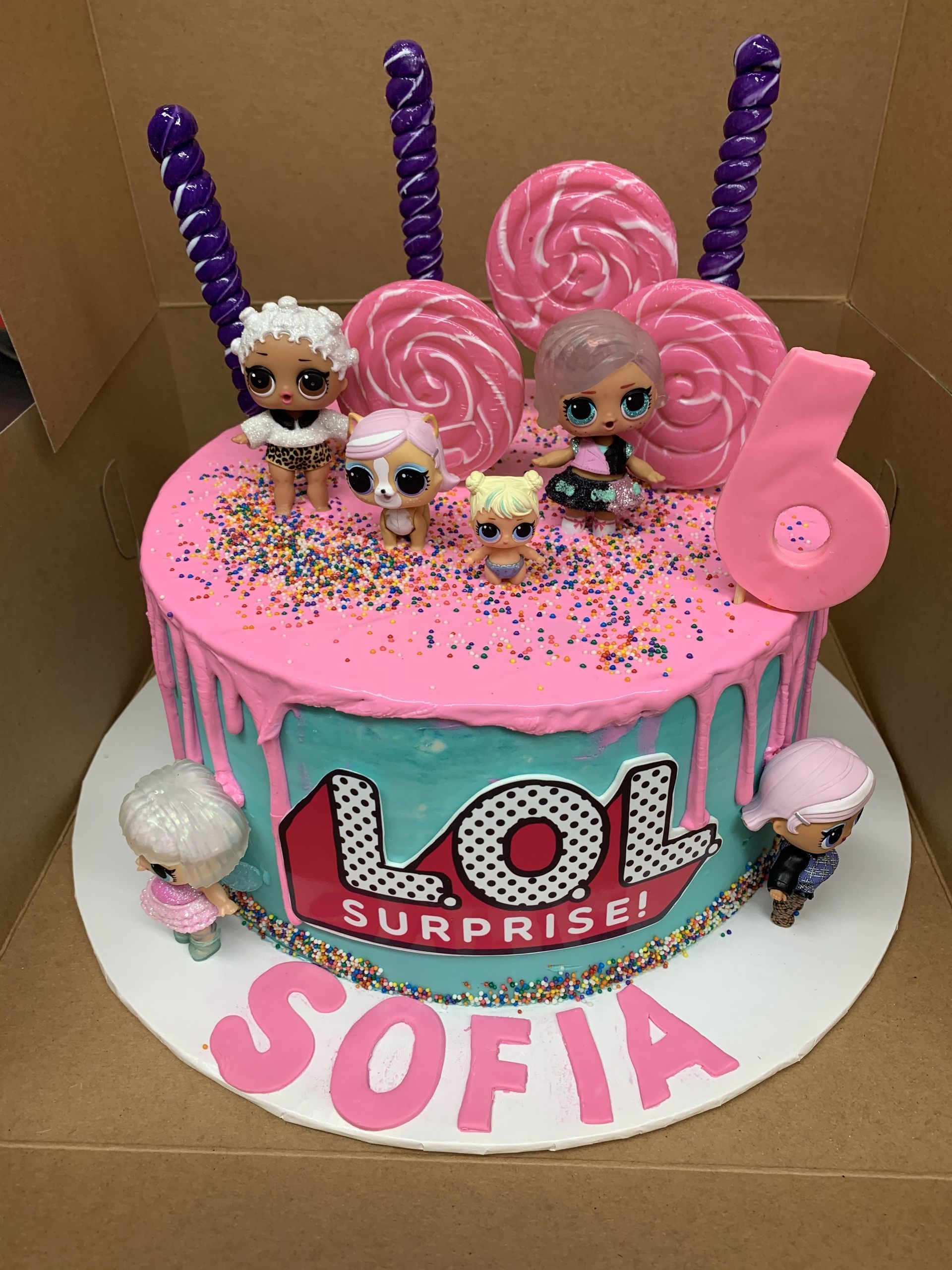 a lol surprise cake for sofia is in a box .