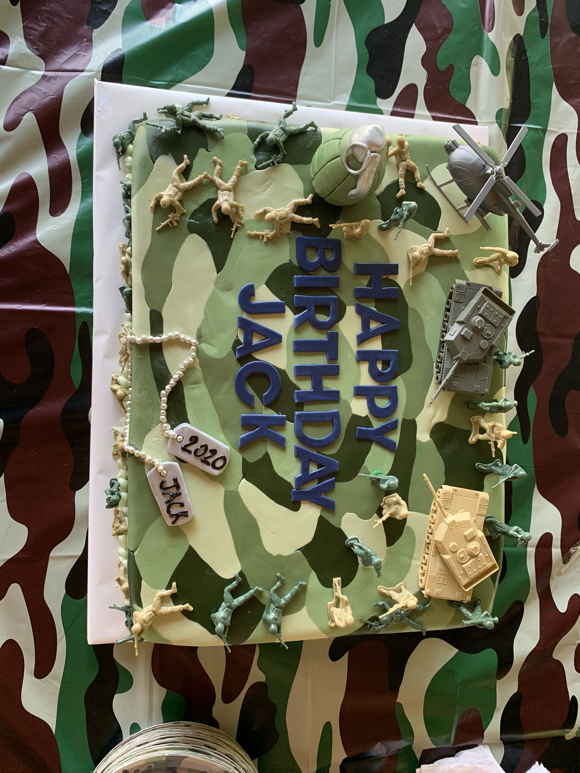 a birthday cake with soldiers on it and the words happy birthday jack