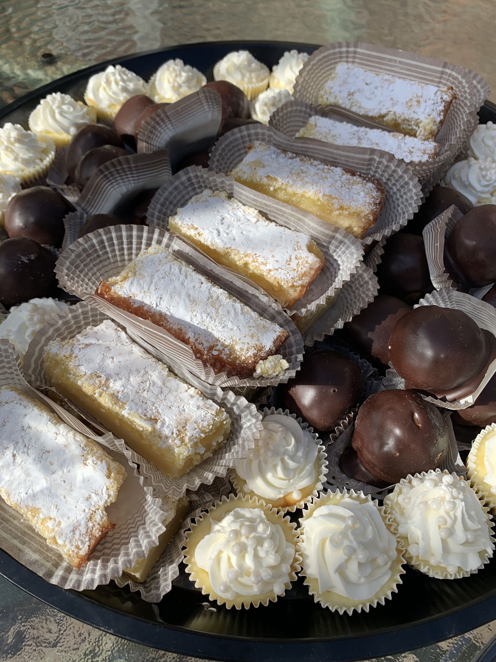 there are many different types of desserts on the plate .