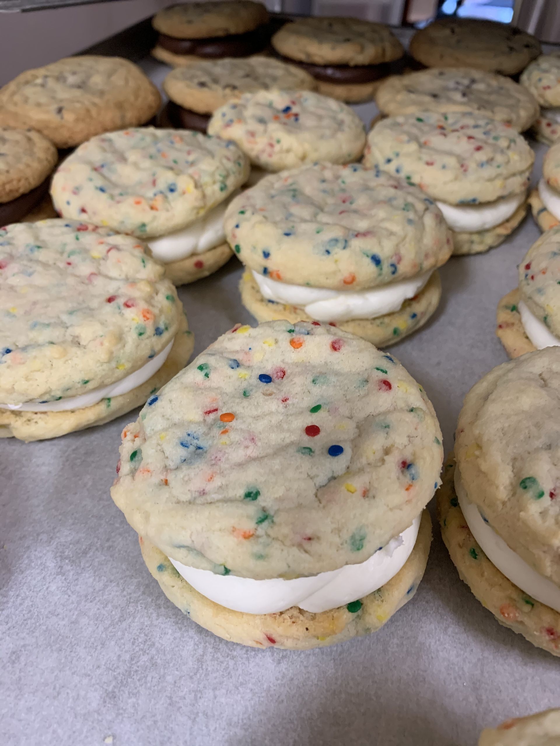 a bunch of cookies stacked on top of each other on a table