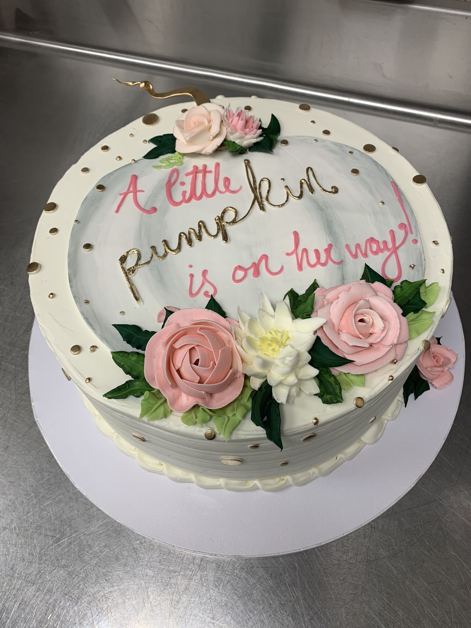 a cake that says a little pumpkin is on her way