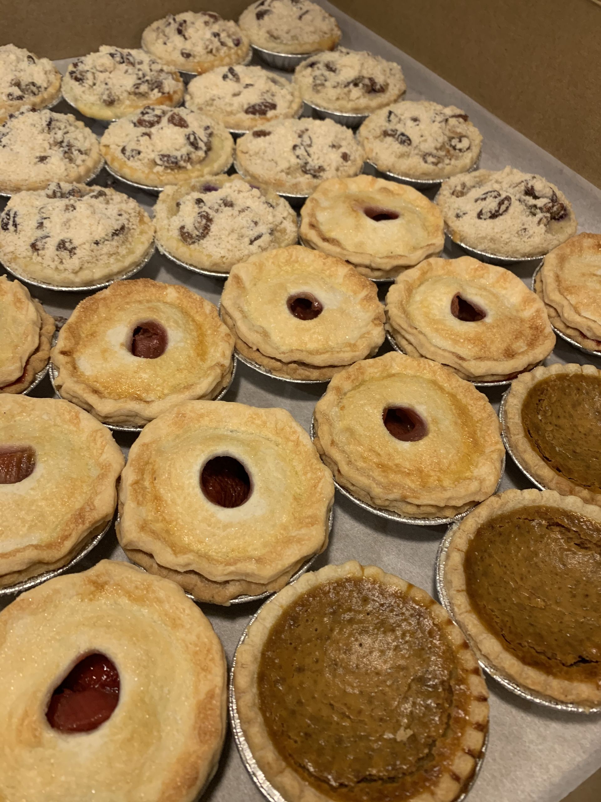 a bunch of pies are sitting on a table