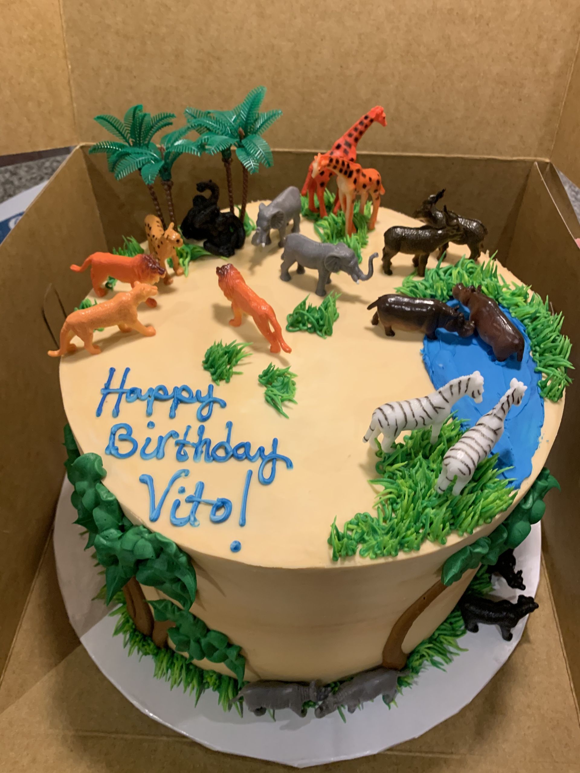 a birthday cake with animals on it that says happy birthday vitol