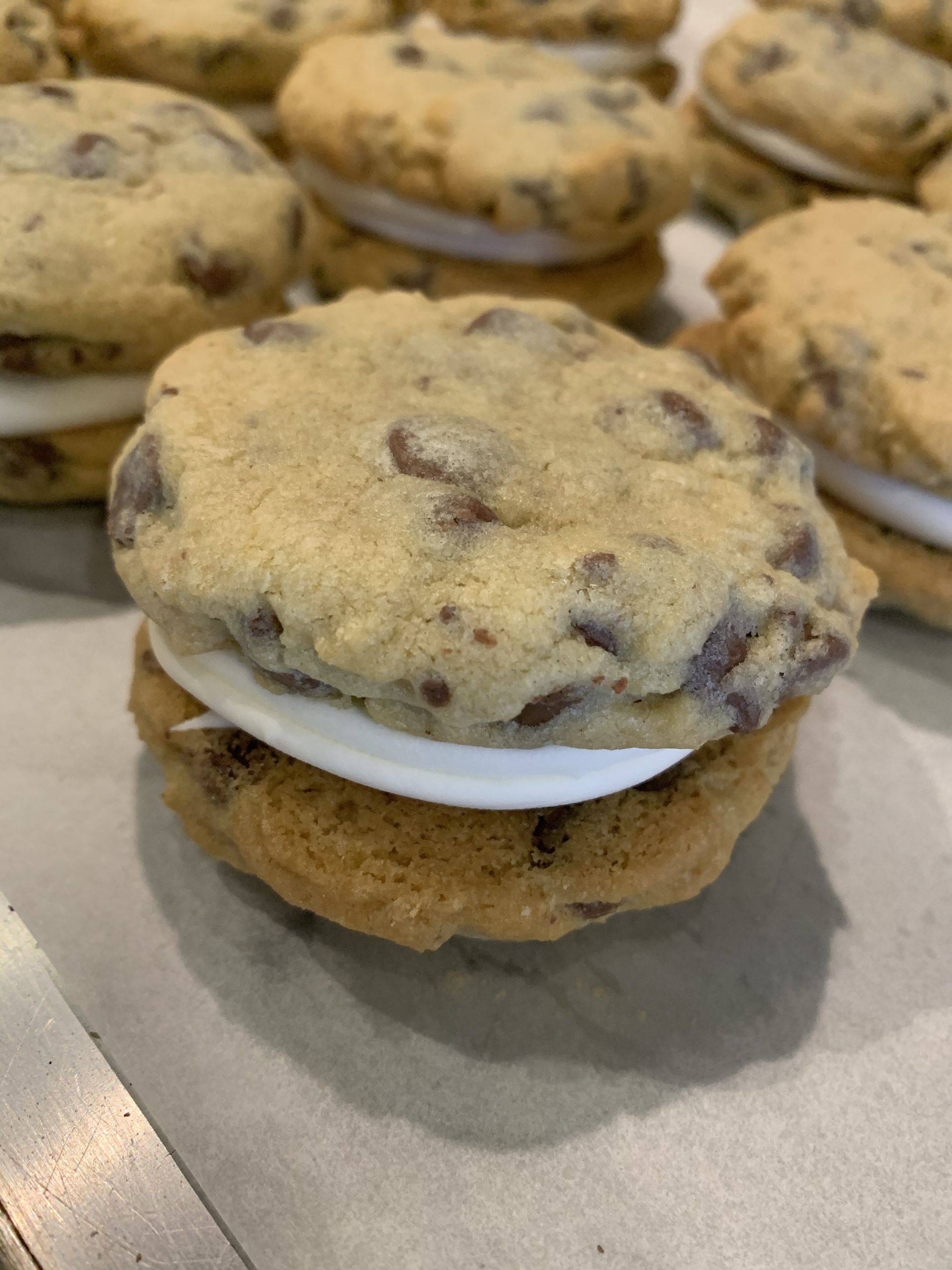 a close up of a s'mores cookie sandwich on a table .