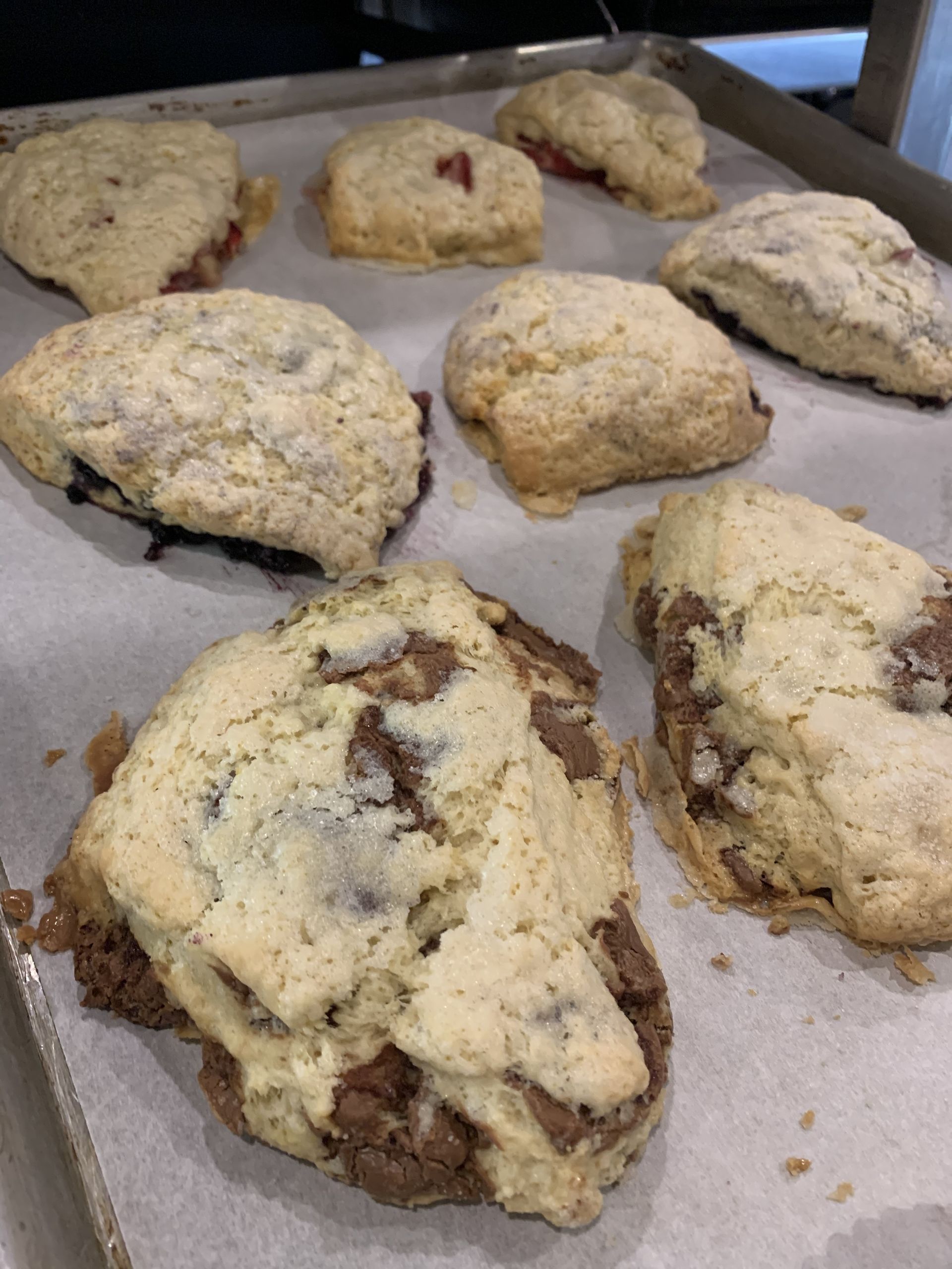a bunch of cookies are sitting on a tray on a table .