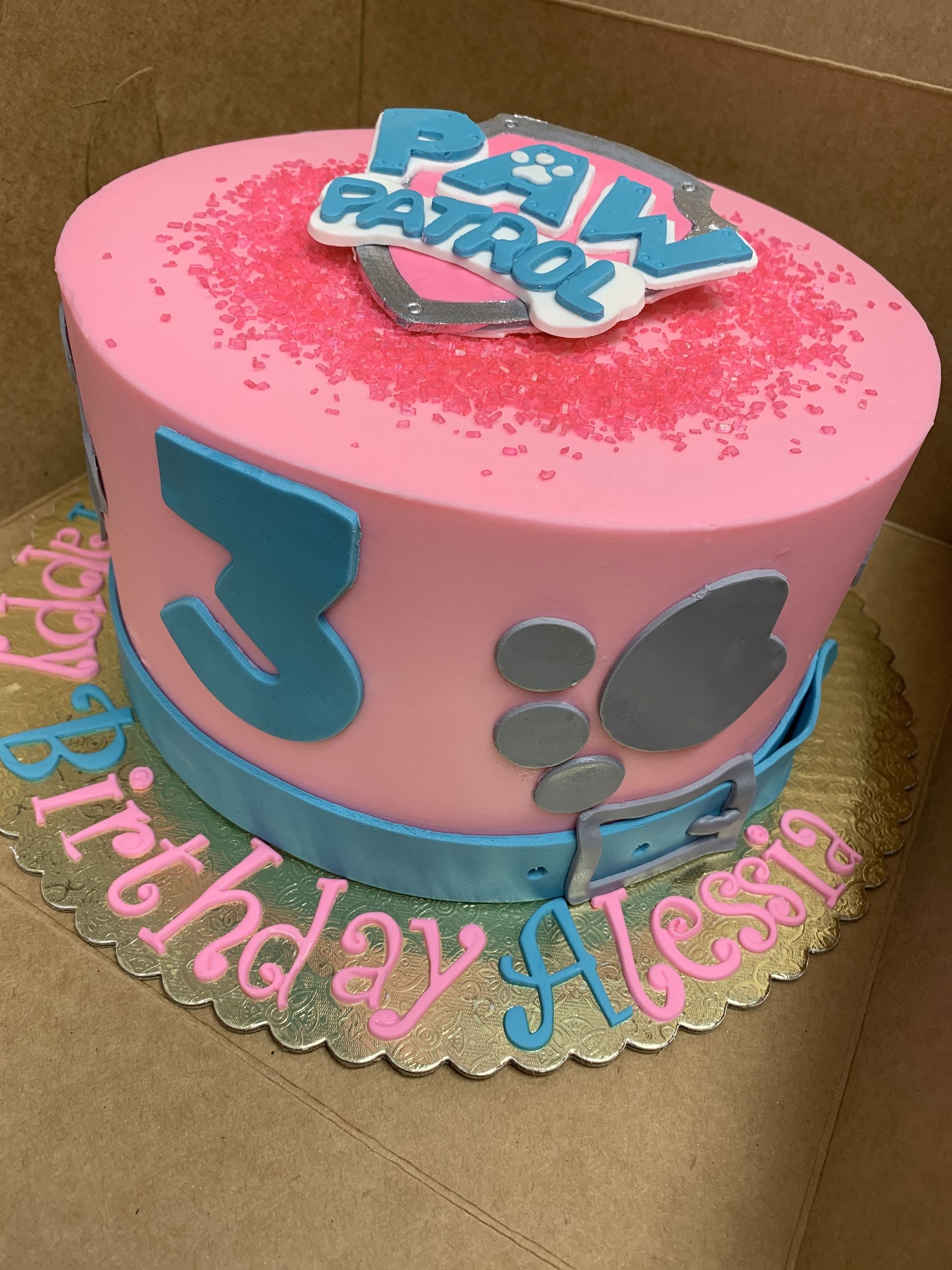a pink and blue paw patrol birthday cake