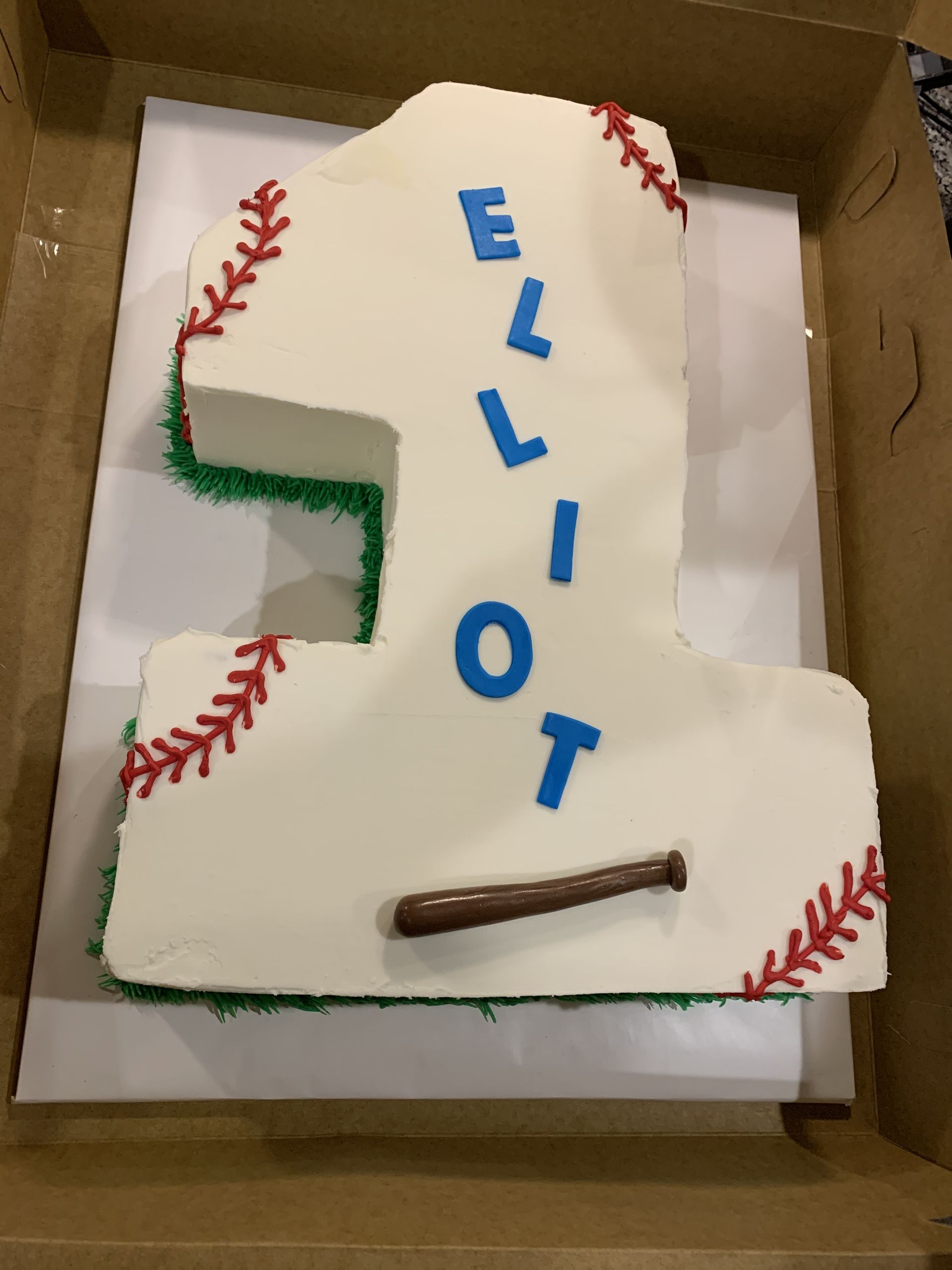 a number 1 cake with the name elliot on it