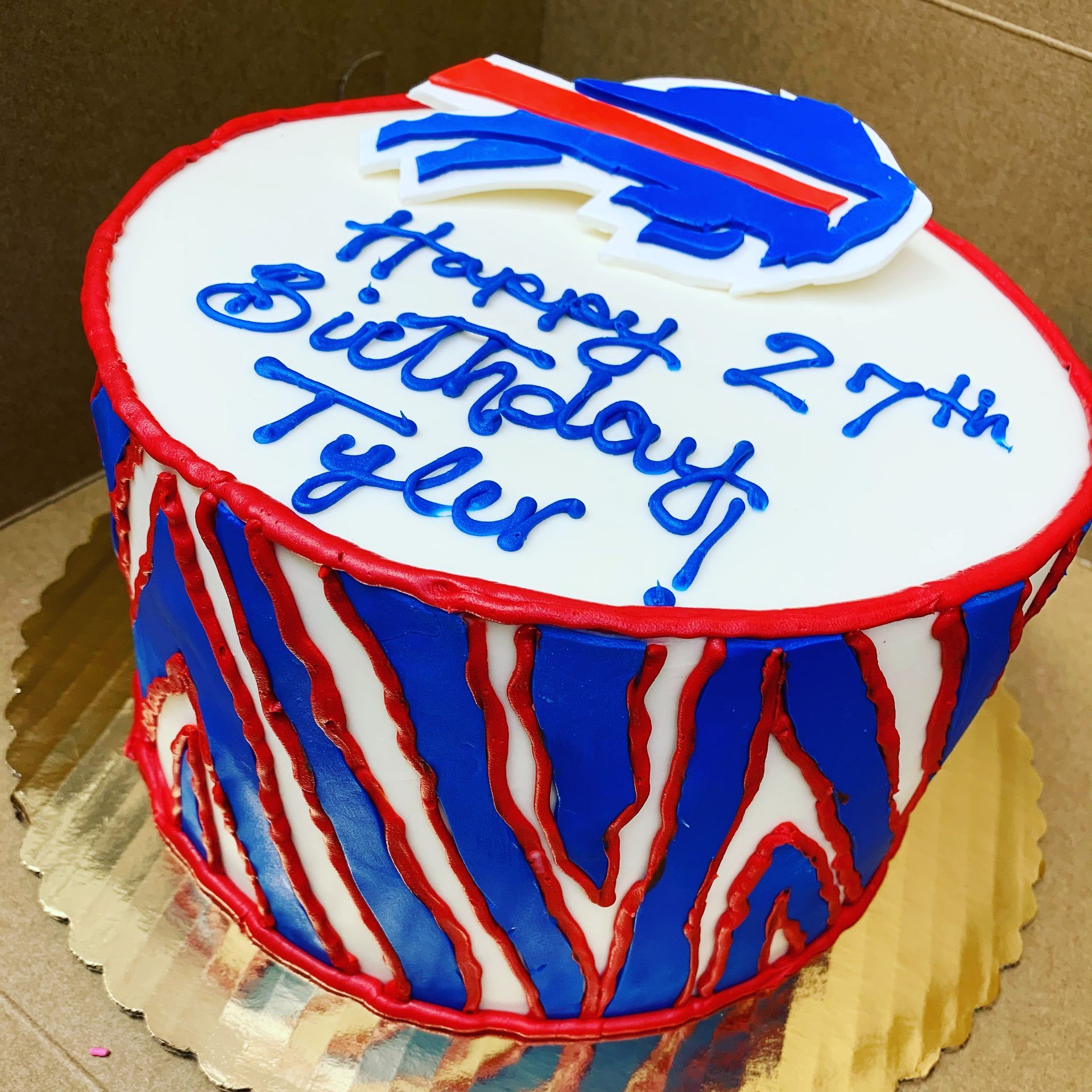 a red white and blue birthday cake for tyler