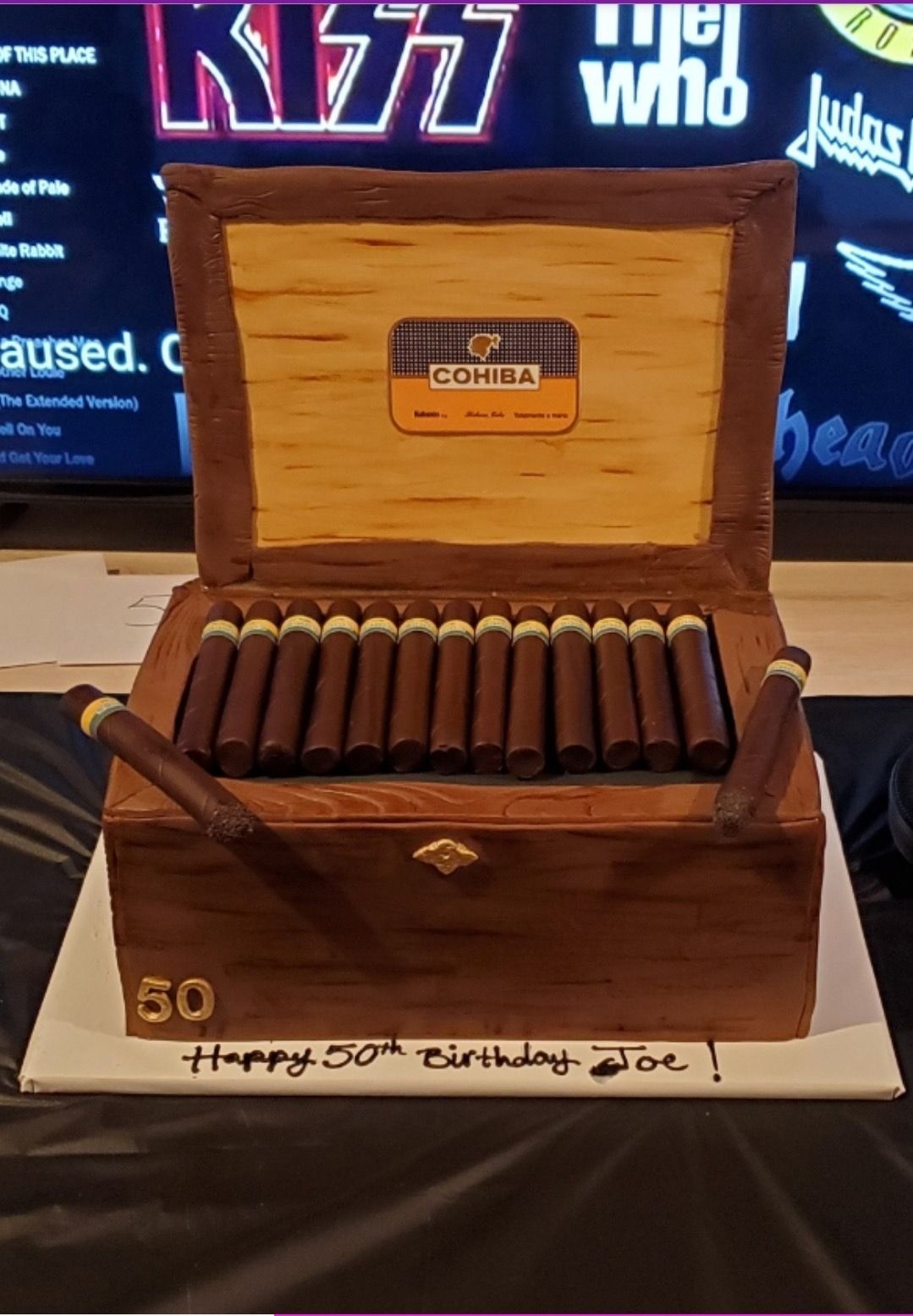 a cake that looks like a box of cigars
