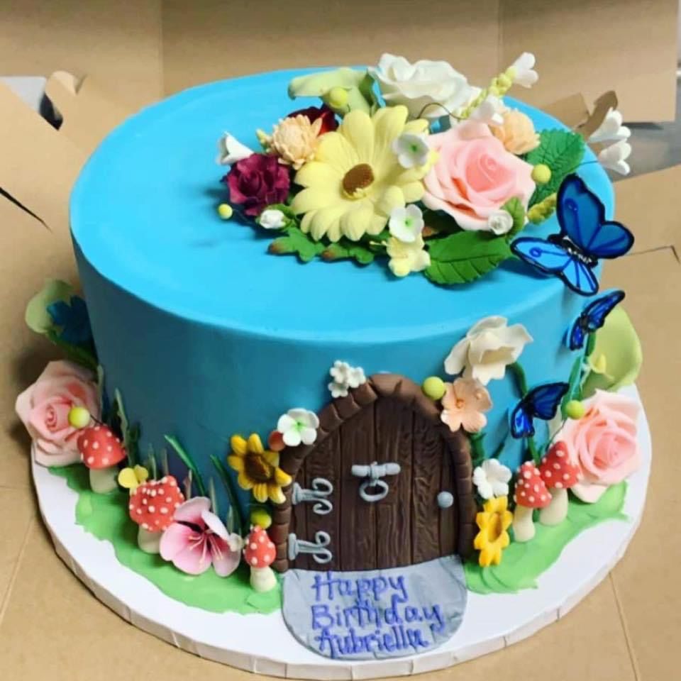 a birthday cake for gabriella with flowers and butterflies