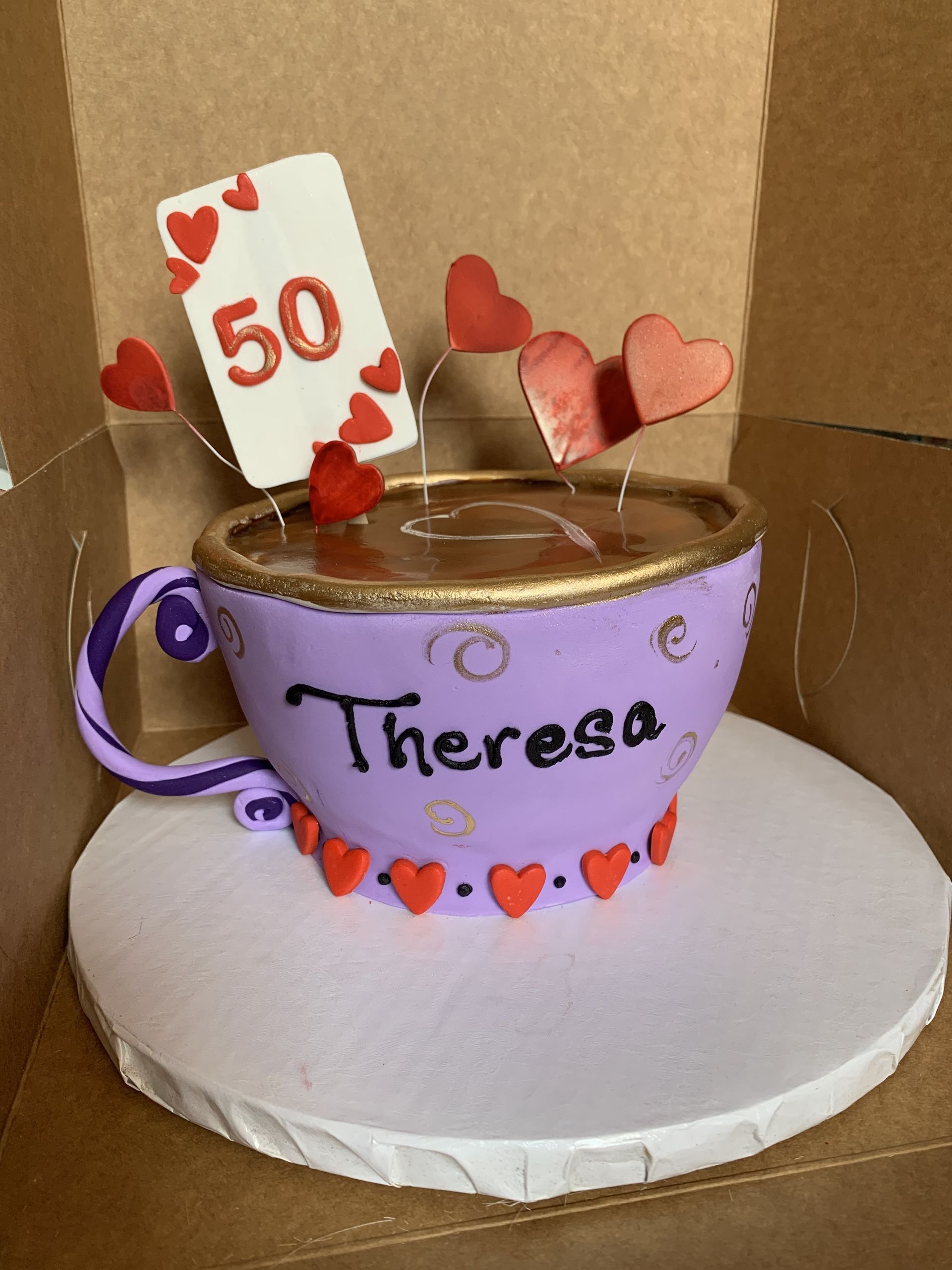 a purple cup with the name theresa on it