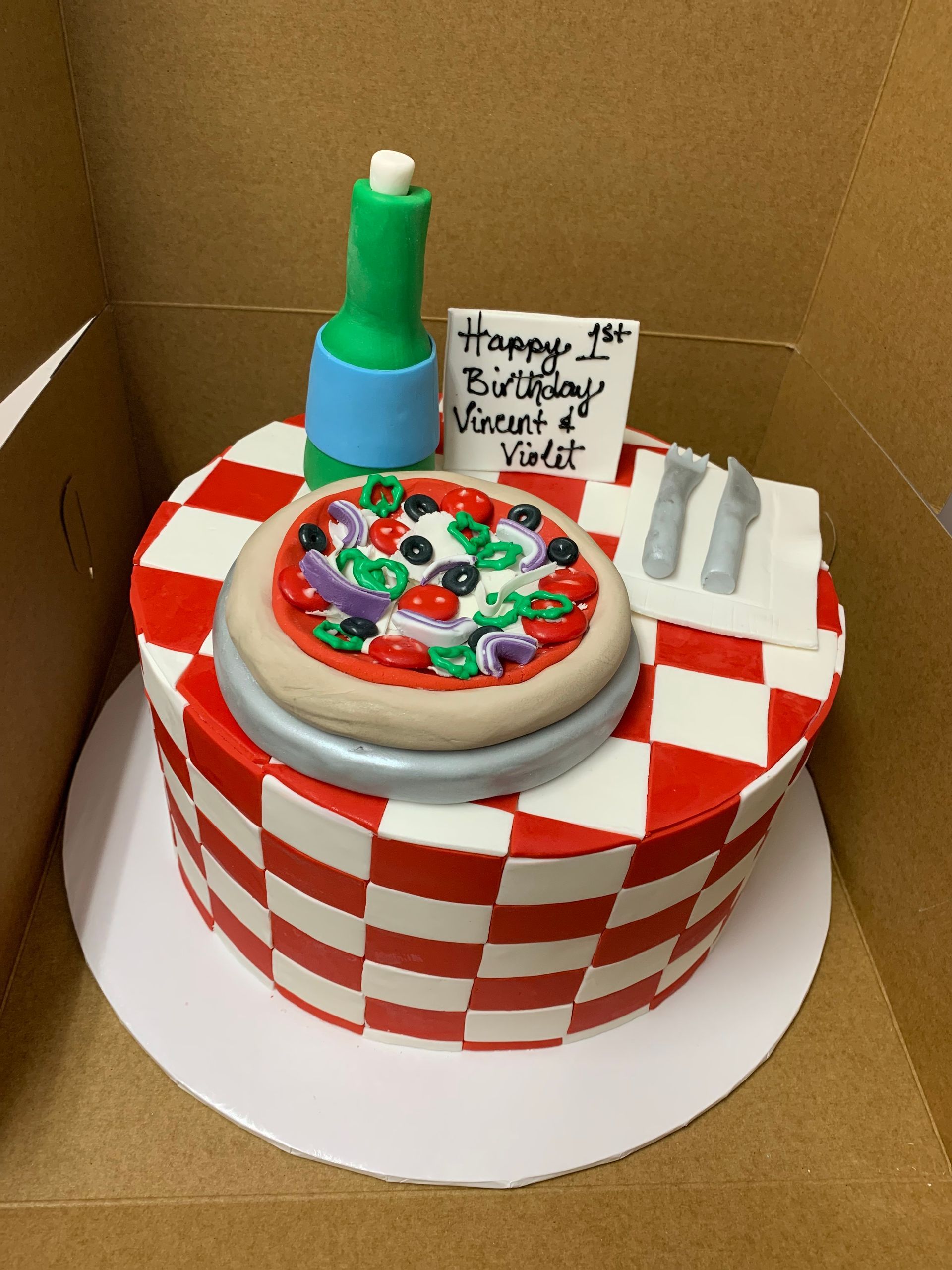 a birthday cake with a pizza on top of it