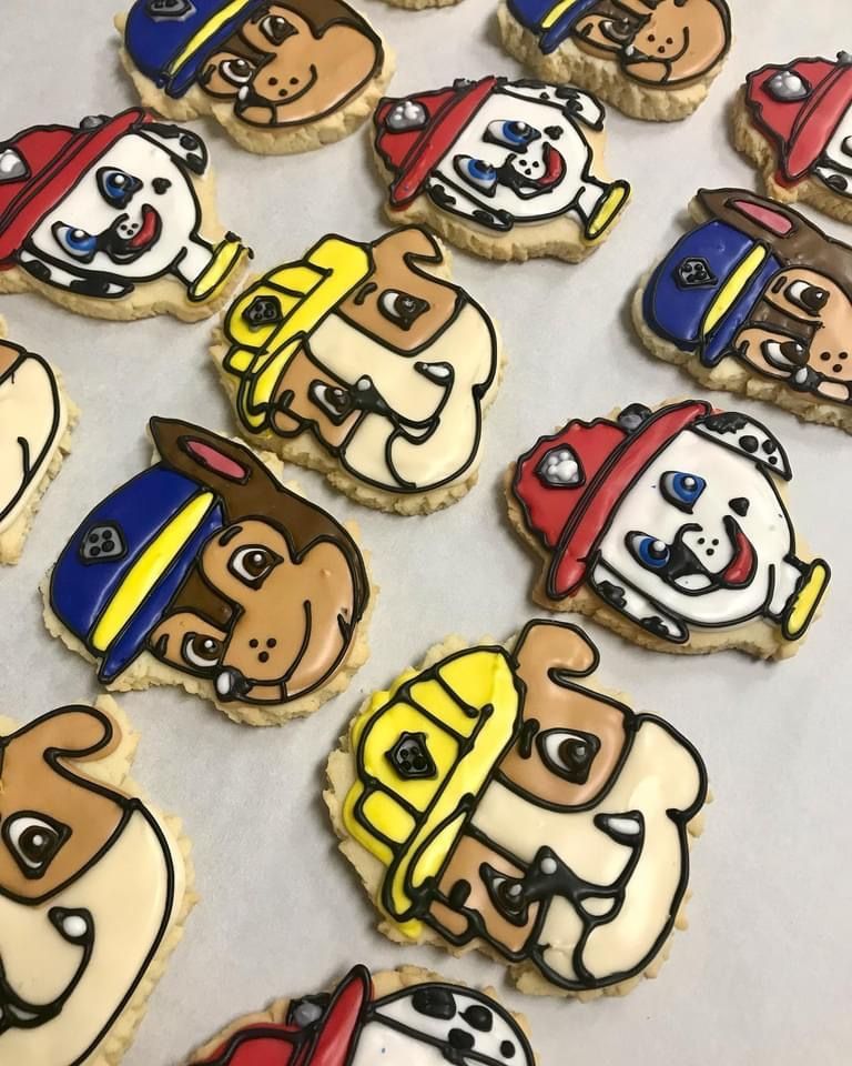 a bunch of cookies with paw patrol characters on them
