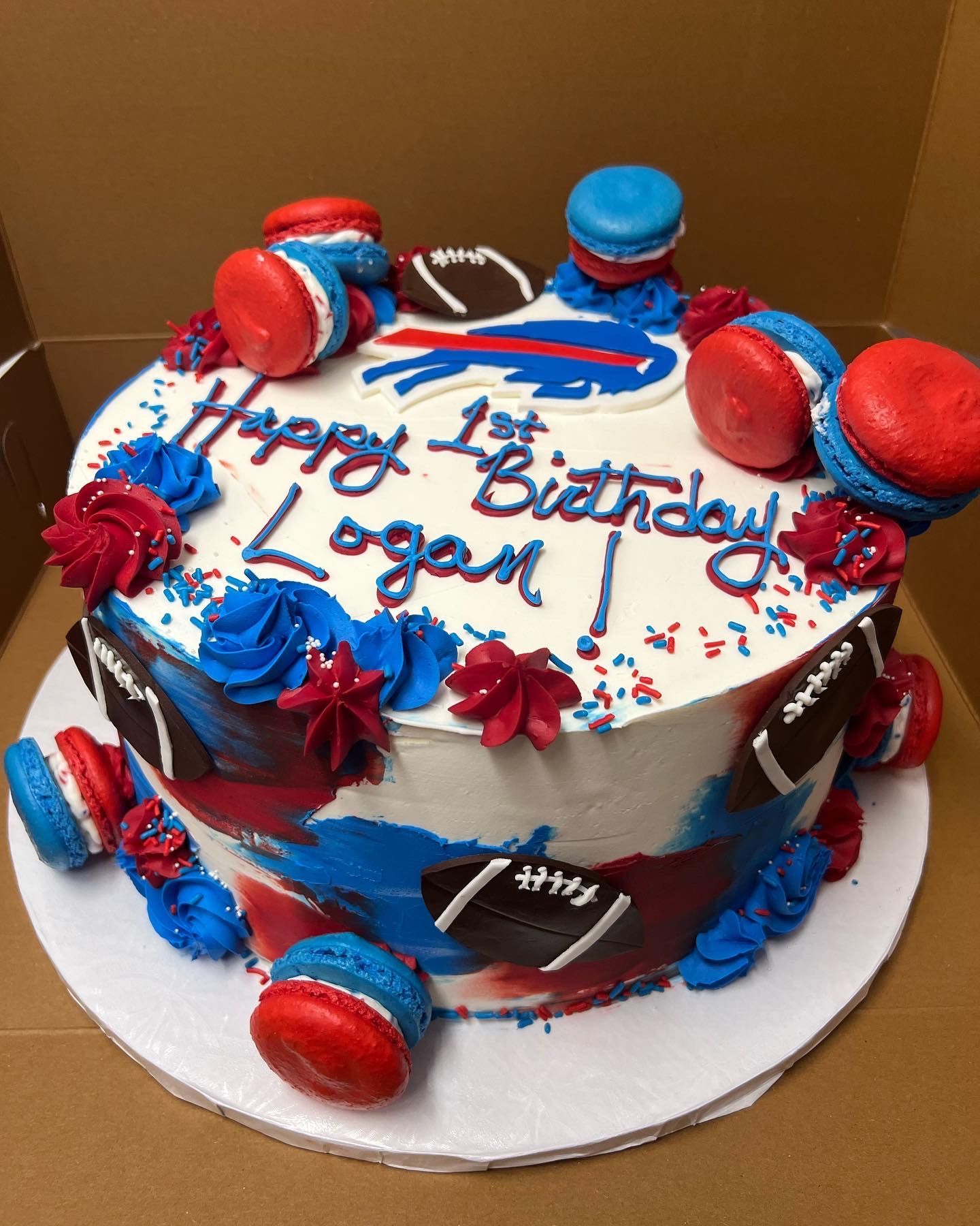 a red white and blue birthday cake for logan