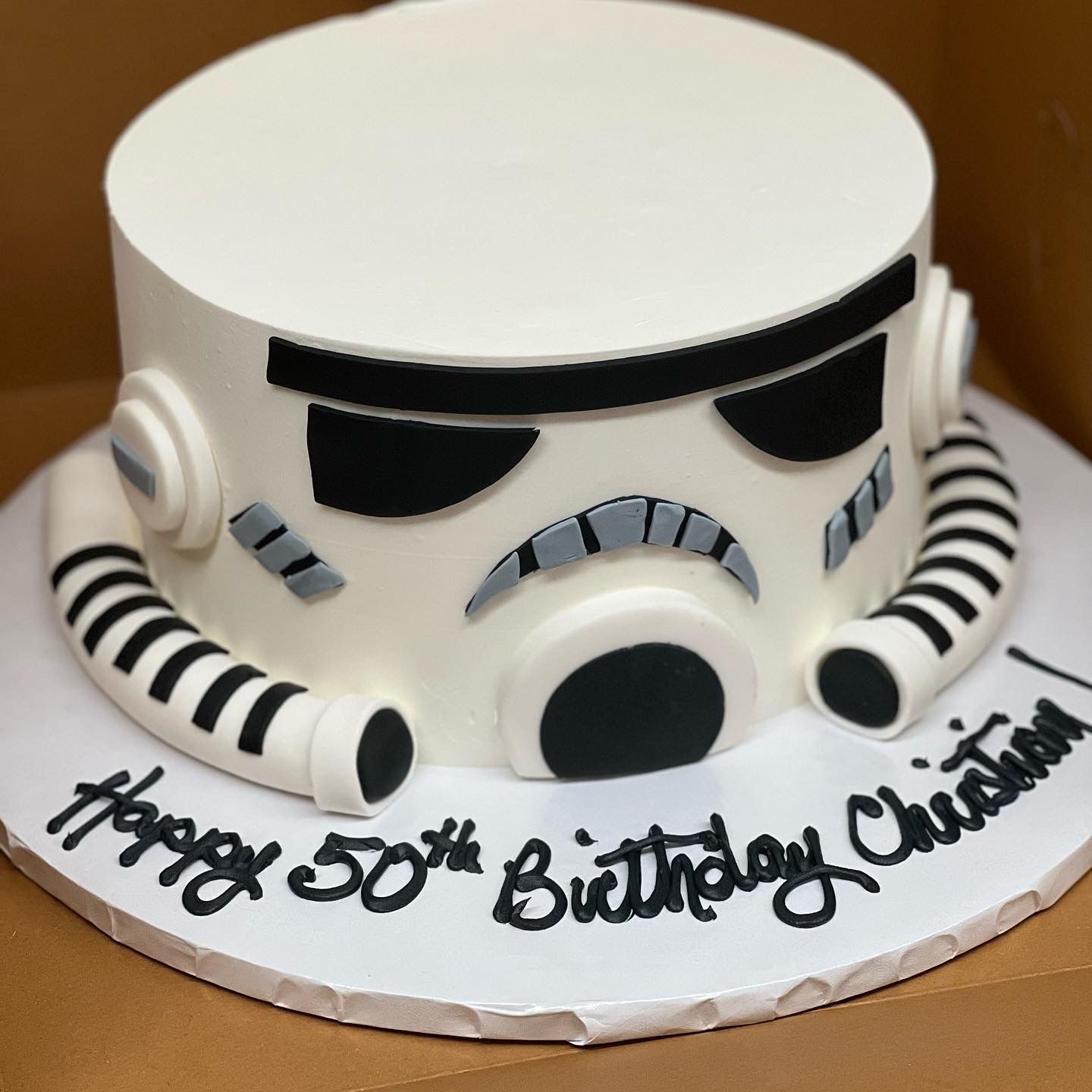 a birthday cake with a storm trooper face on it