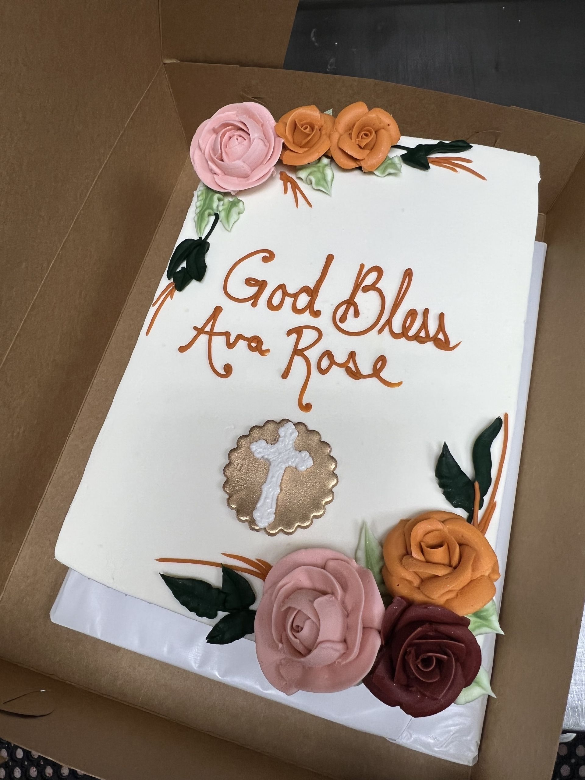a cake in a box that says god bless ara rose