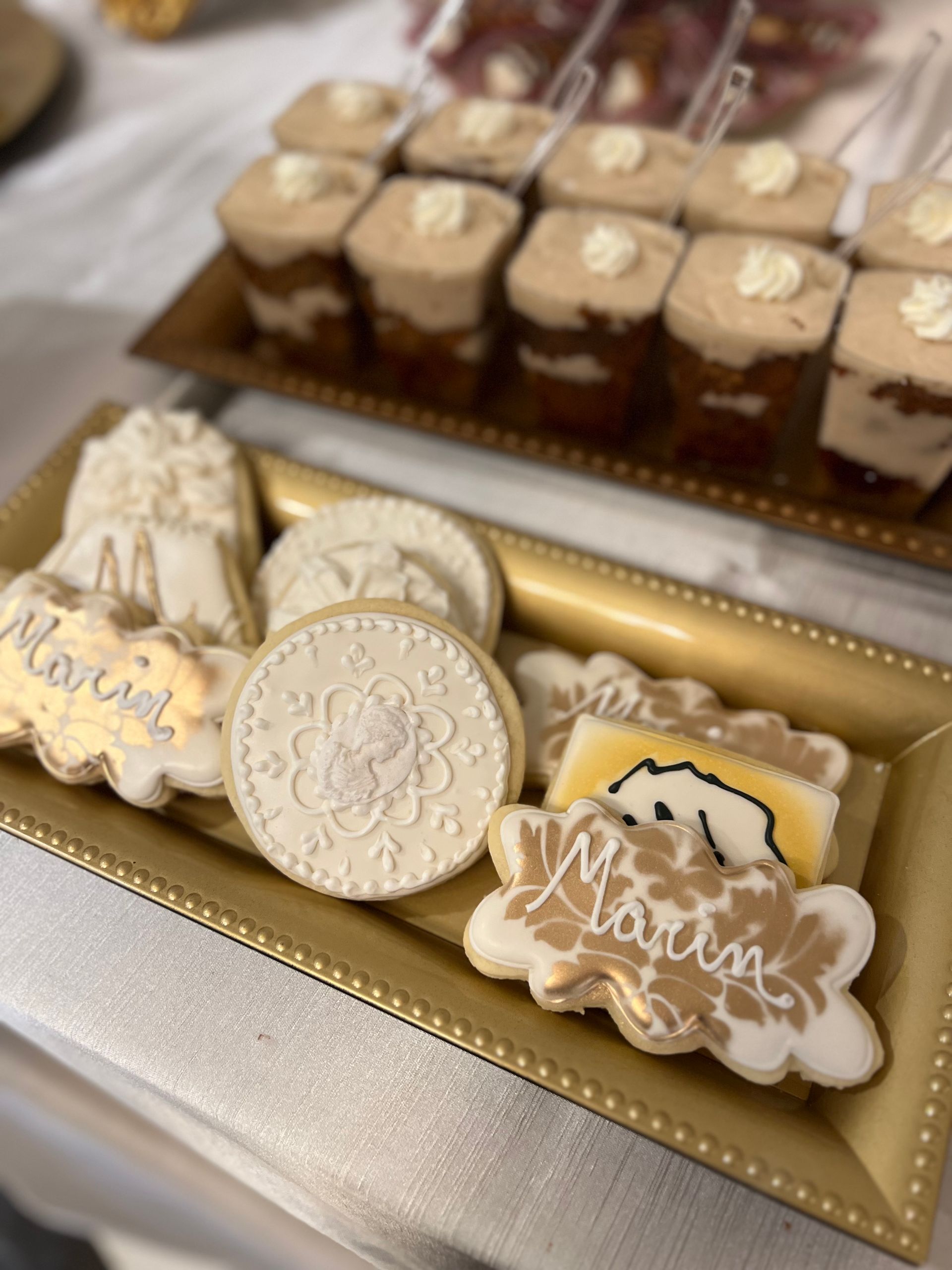 a tray of cookies with the name marisa on it