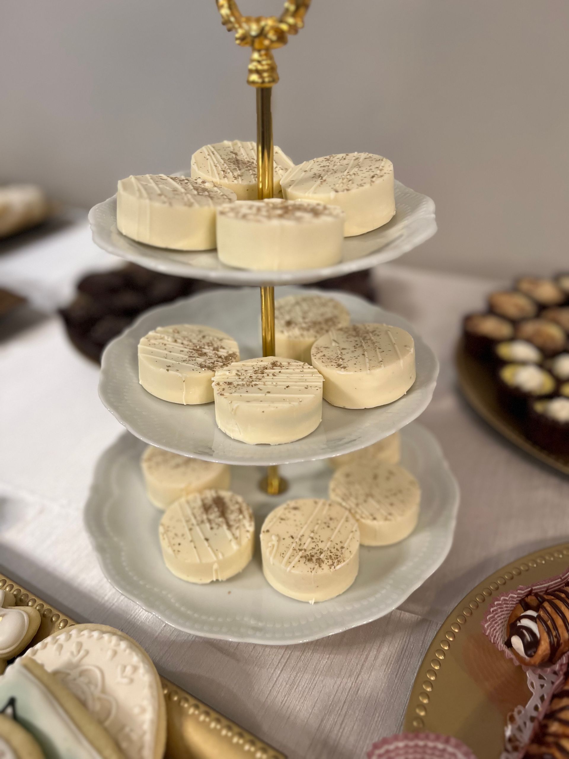 a three tiered display of cookies on a table