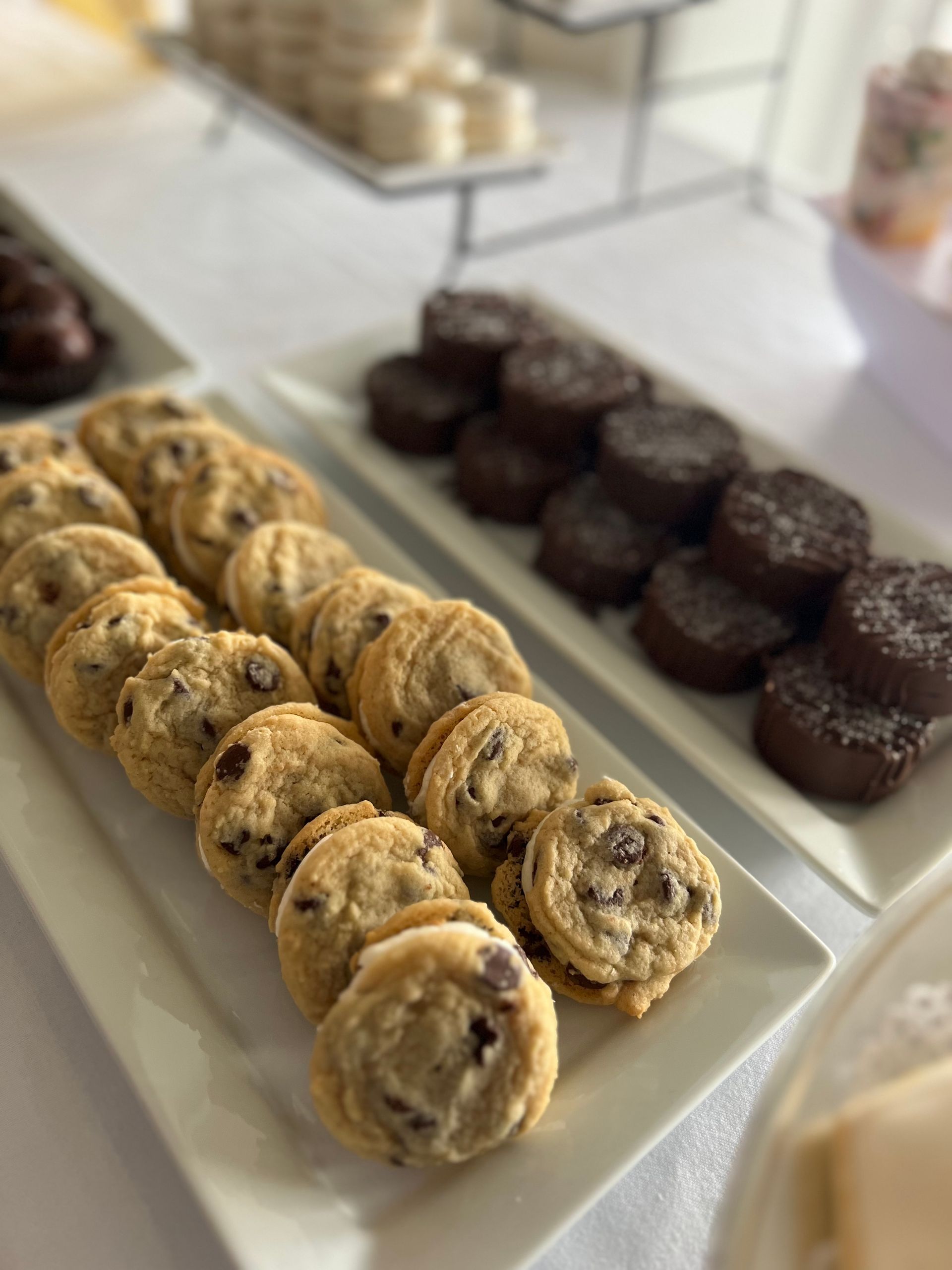 a tray of chocolate chip cookies and brownies on a table .