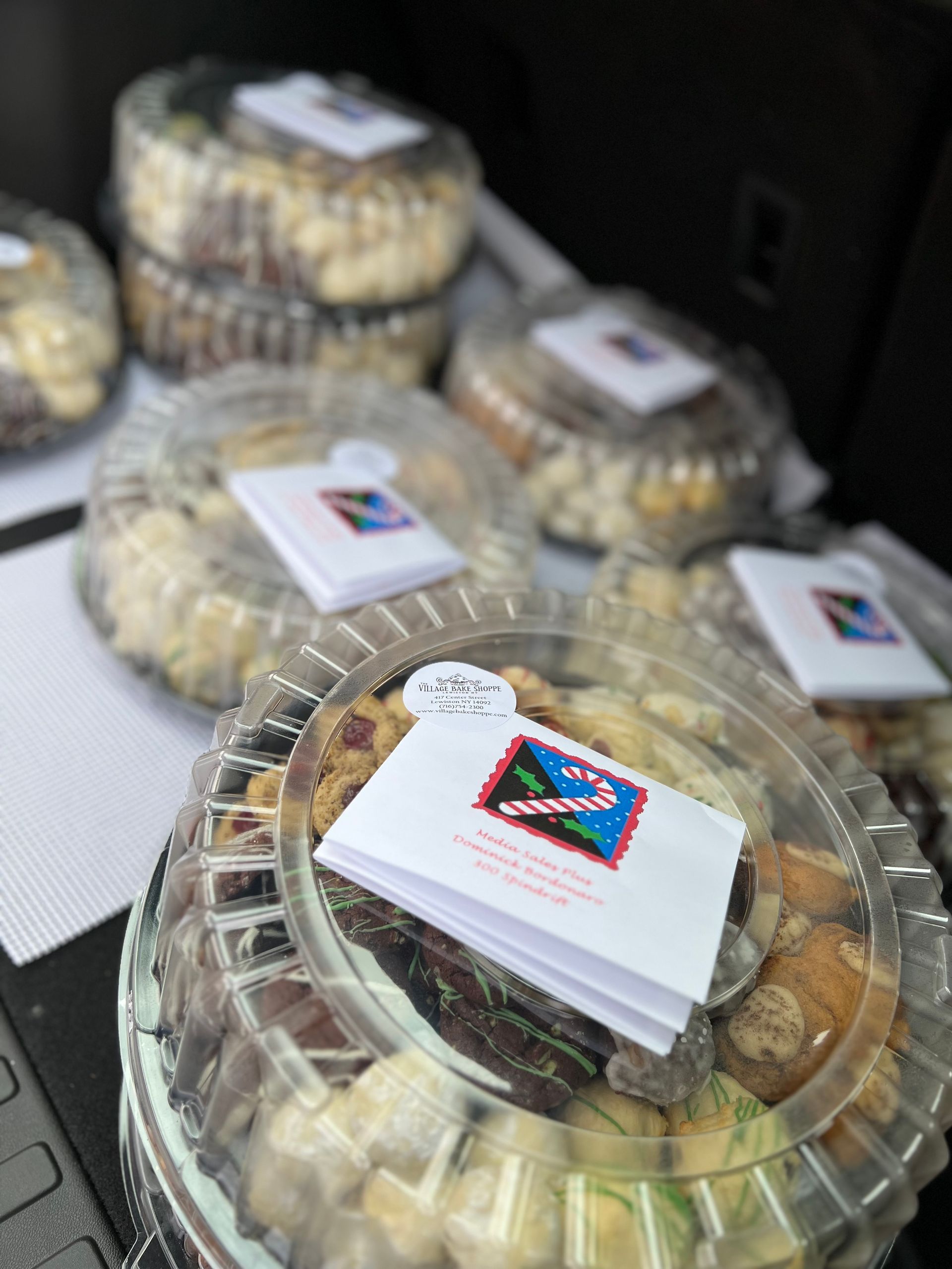 a bunch of plastic containers filled with food are sitting on a table .
