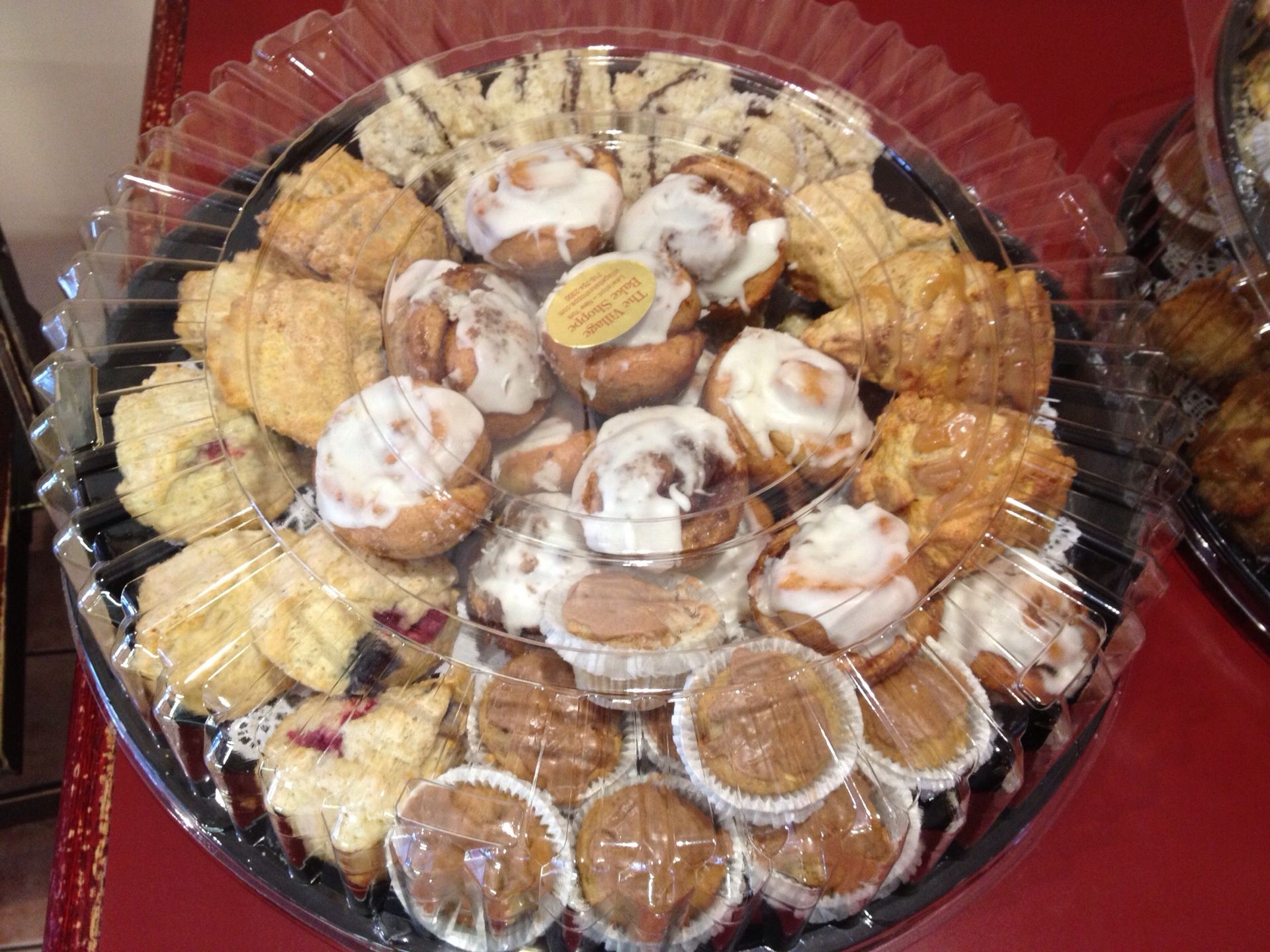 there are many different types of pastries on the tray .