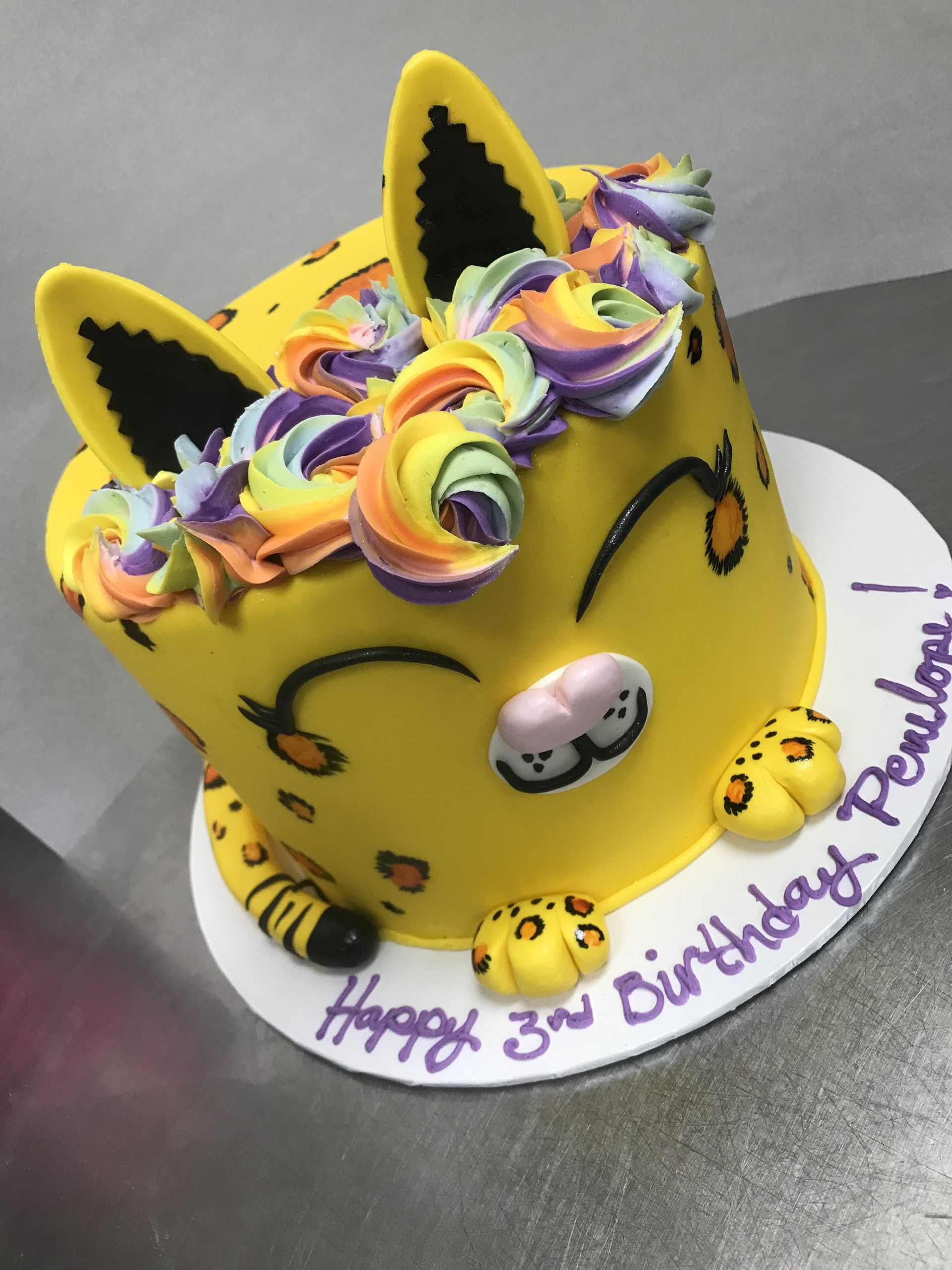 a yellow cake that says happy 3rd birthday on it