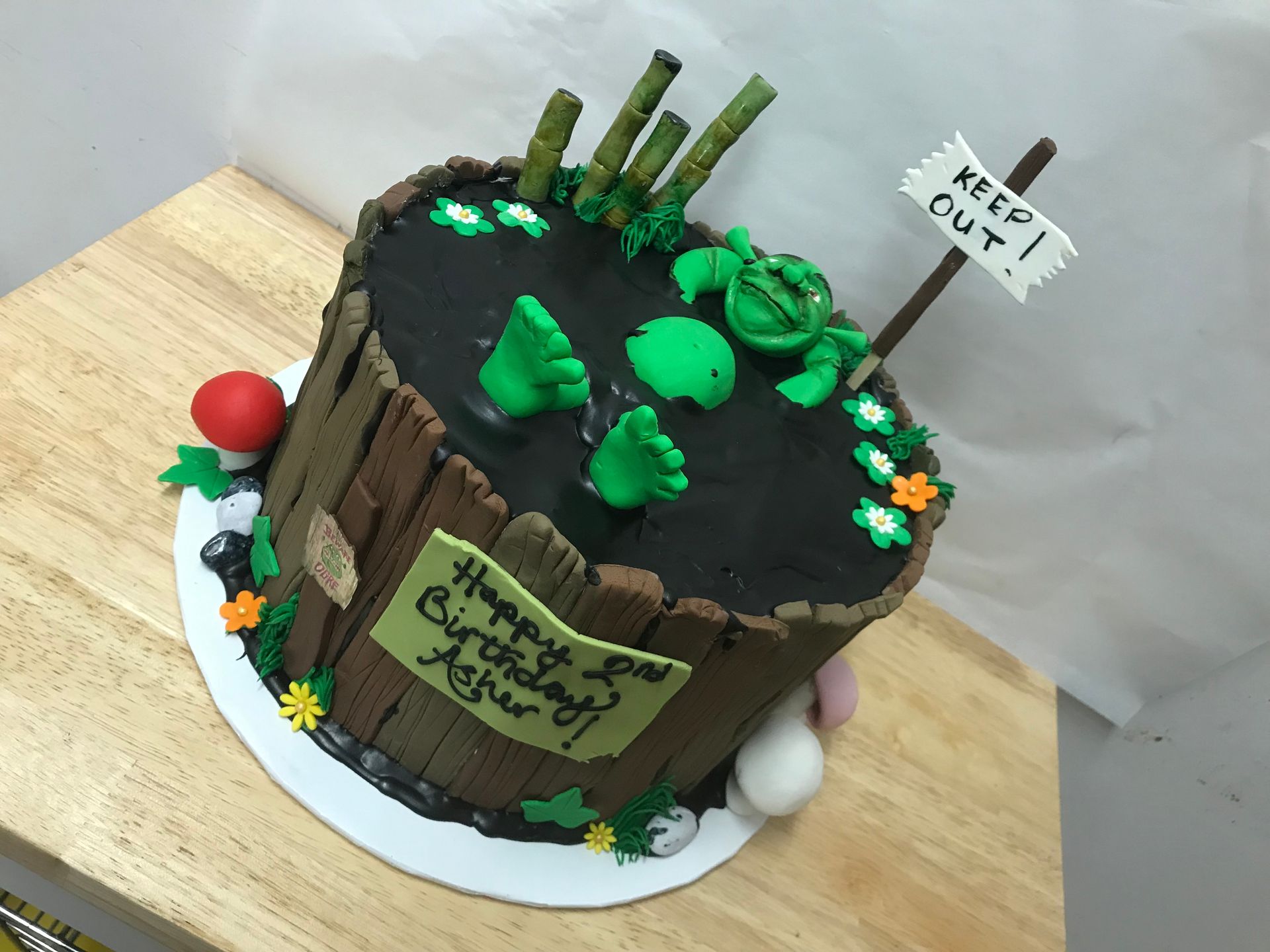 a cake with shrek and a sign that says keep out