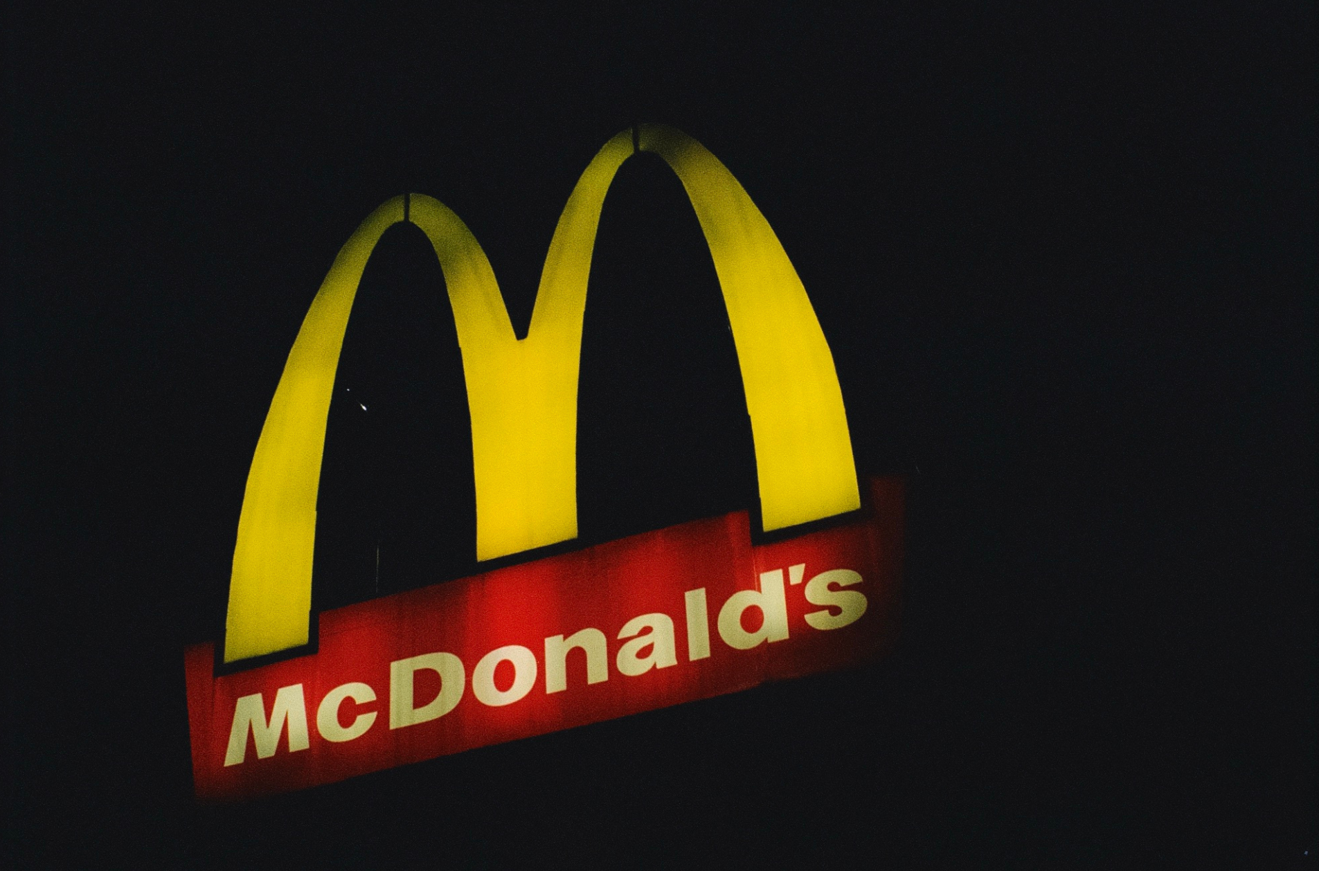 Illuminated McDonalds sign at night