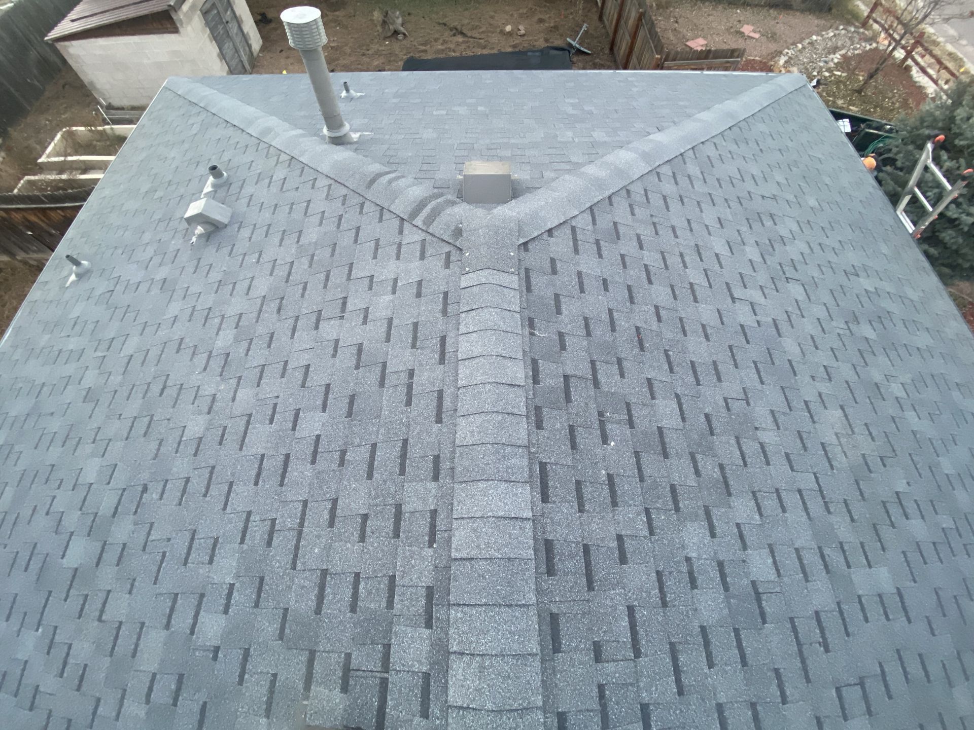An aerial view of a roof with shingles on it.