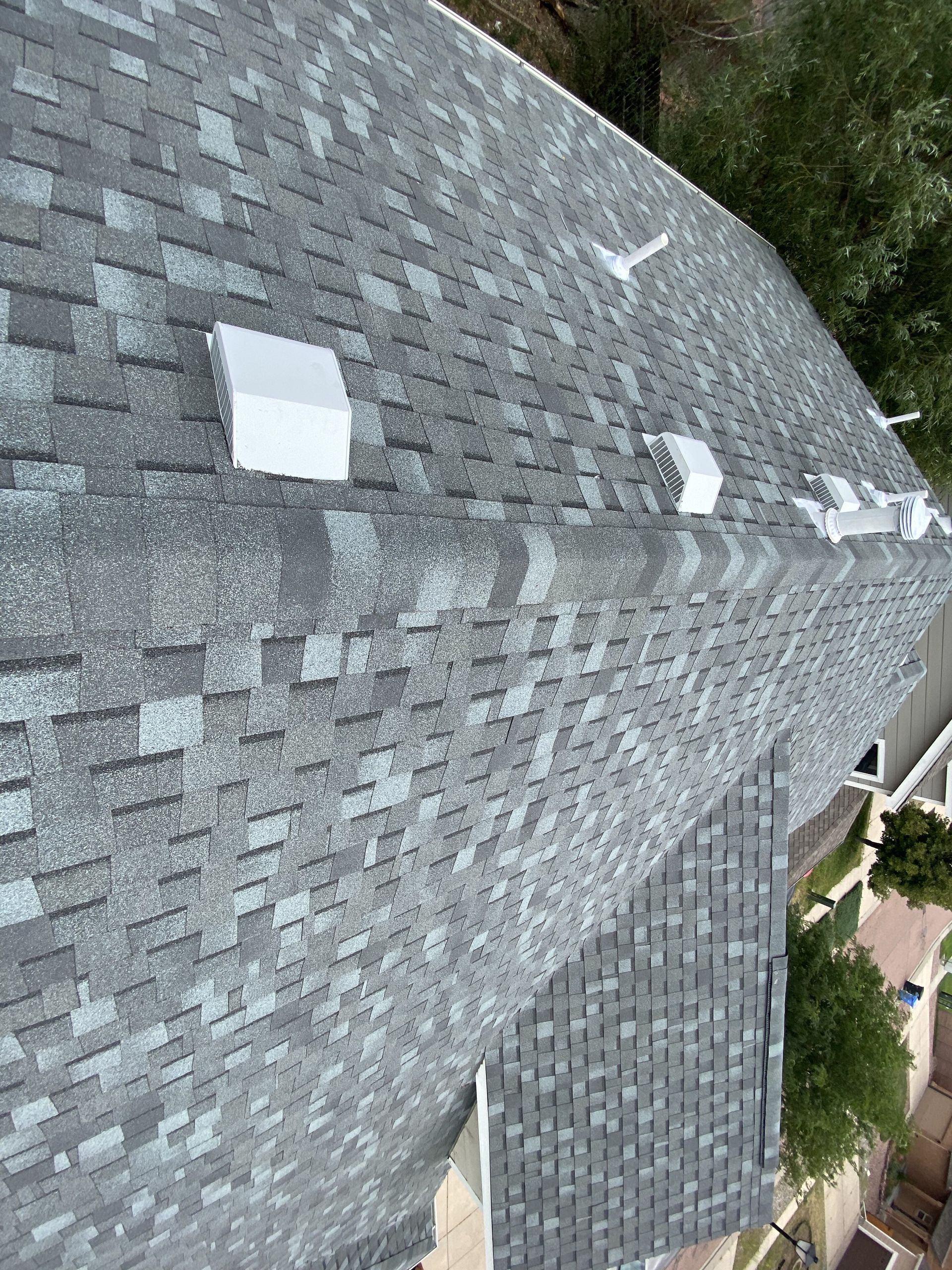 An aerial view of a roof with a lot of shingles on it.