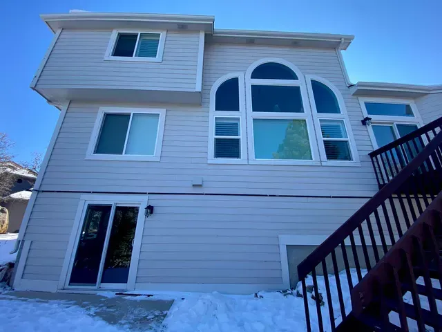 The back of a house with stairs leading up to it