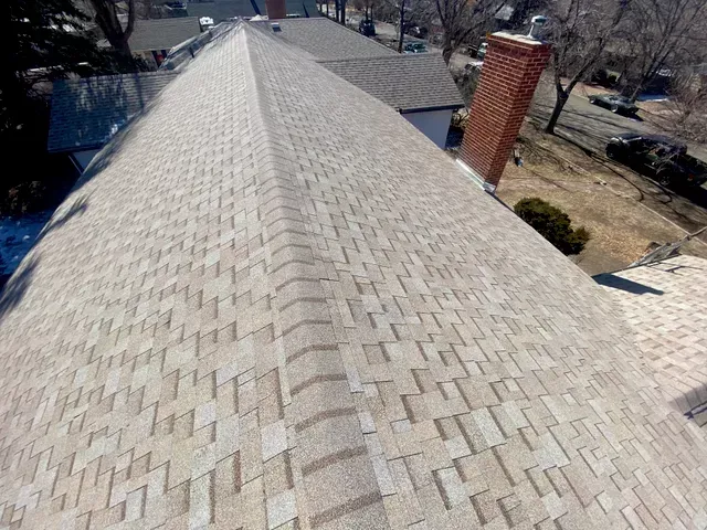 An aerial view of a roof of a house with a chimney