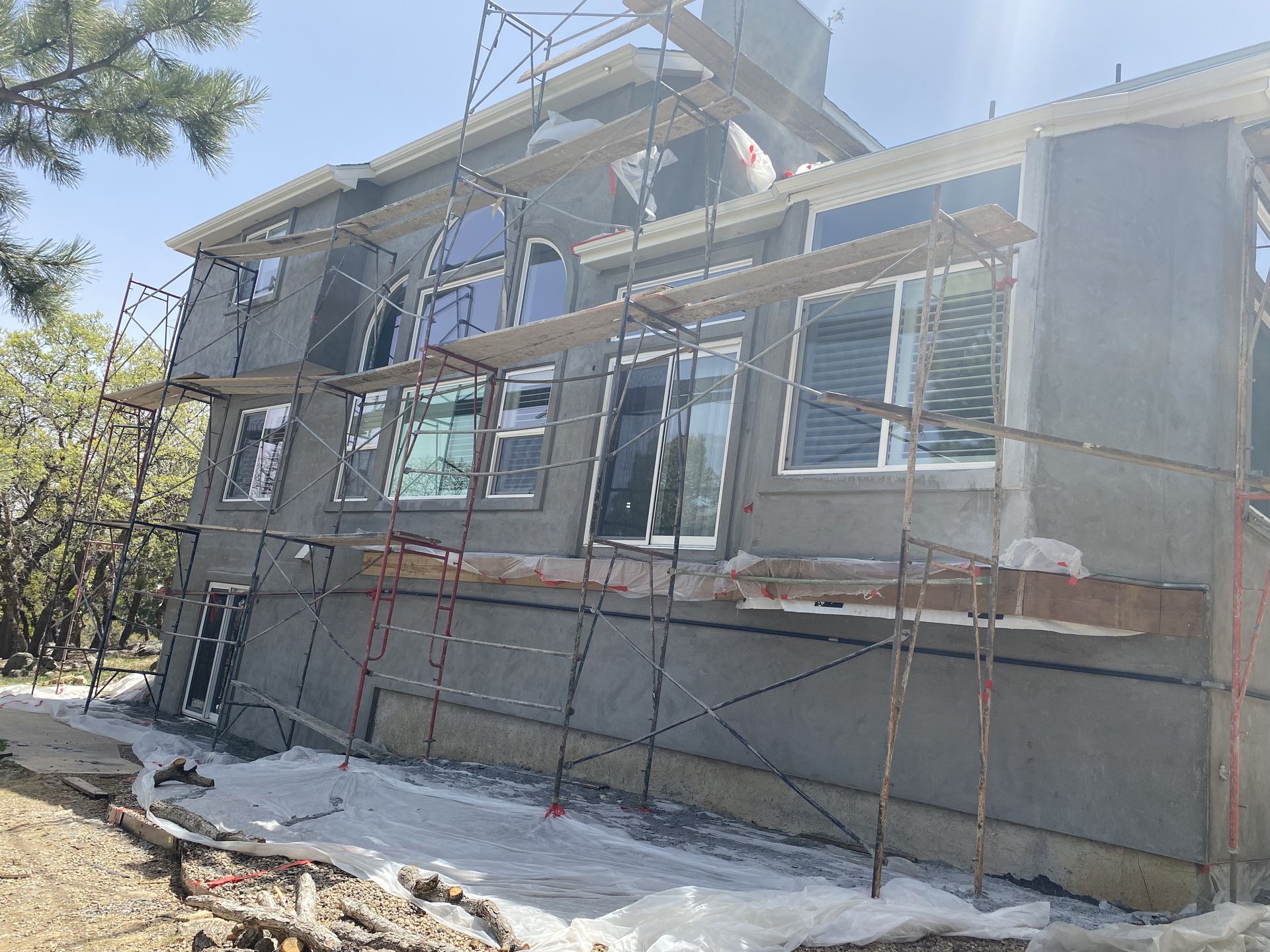 A large house is being built with scaffolding around it.