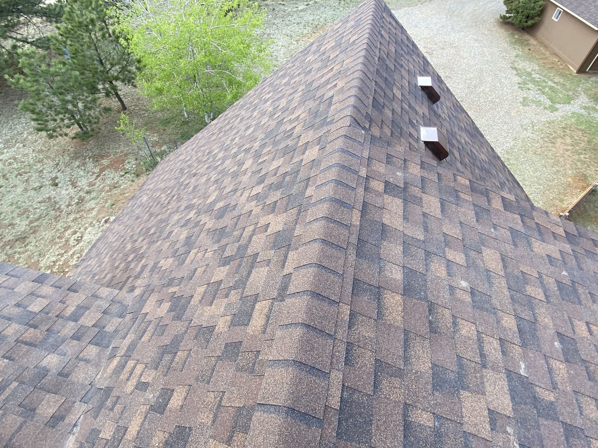 An aerial view of a roof with a lot of shingles on it.