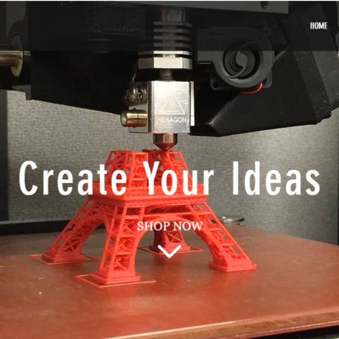 A red eiffel tower is being printed by a 3d printer