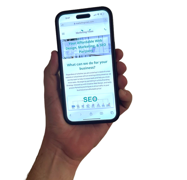 A hand is holding a cell phone with the word seo on the screen.