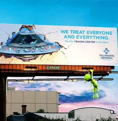 A billboard that says we treat everyone and everything