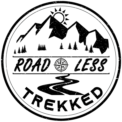 A black and white logo for a company called road less trekked.
