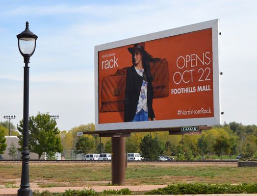 A billboard that says opens oct 22 on it