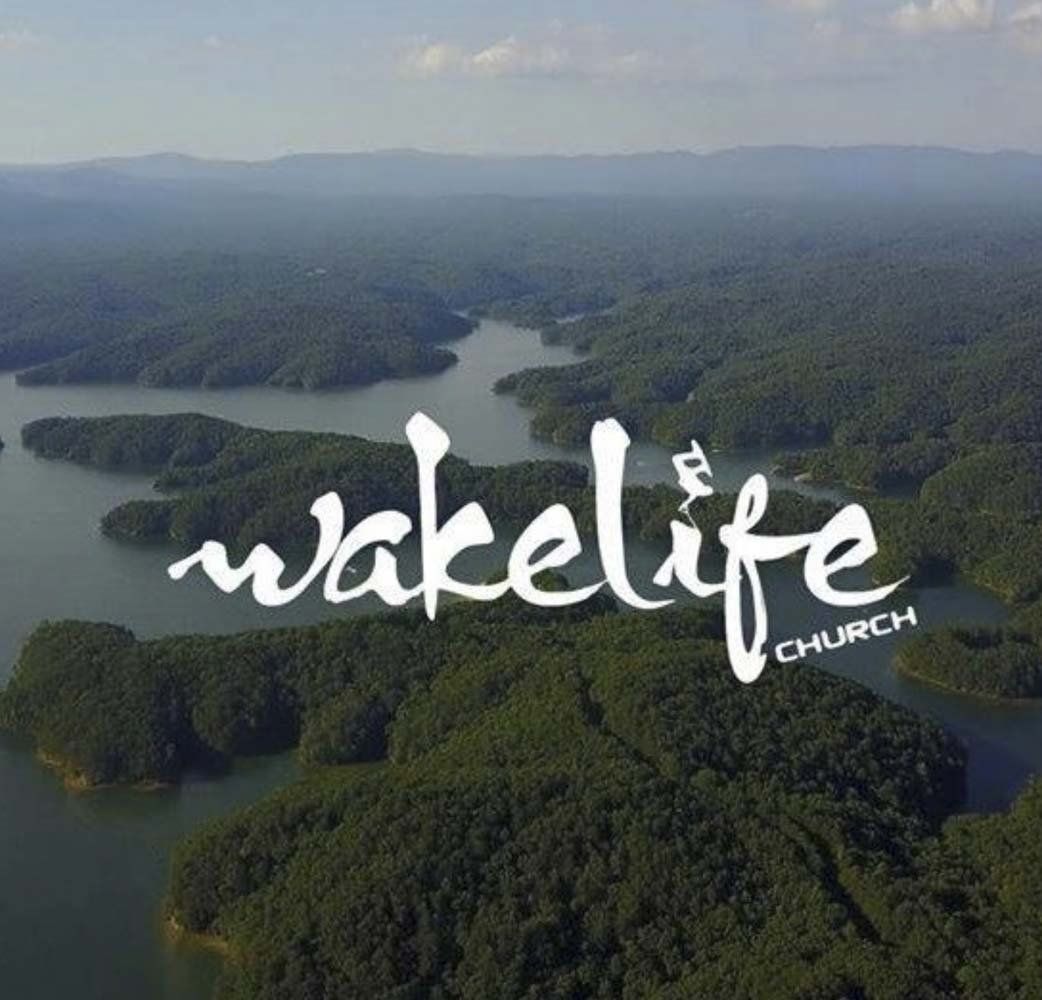 An aerial view of a lake with wakelife church written on it