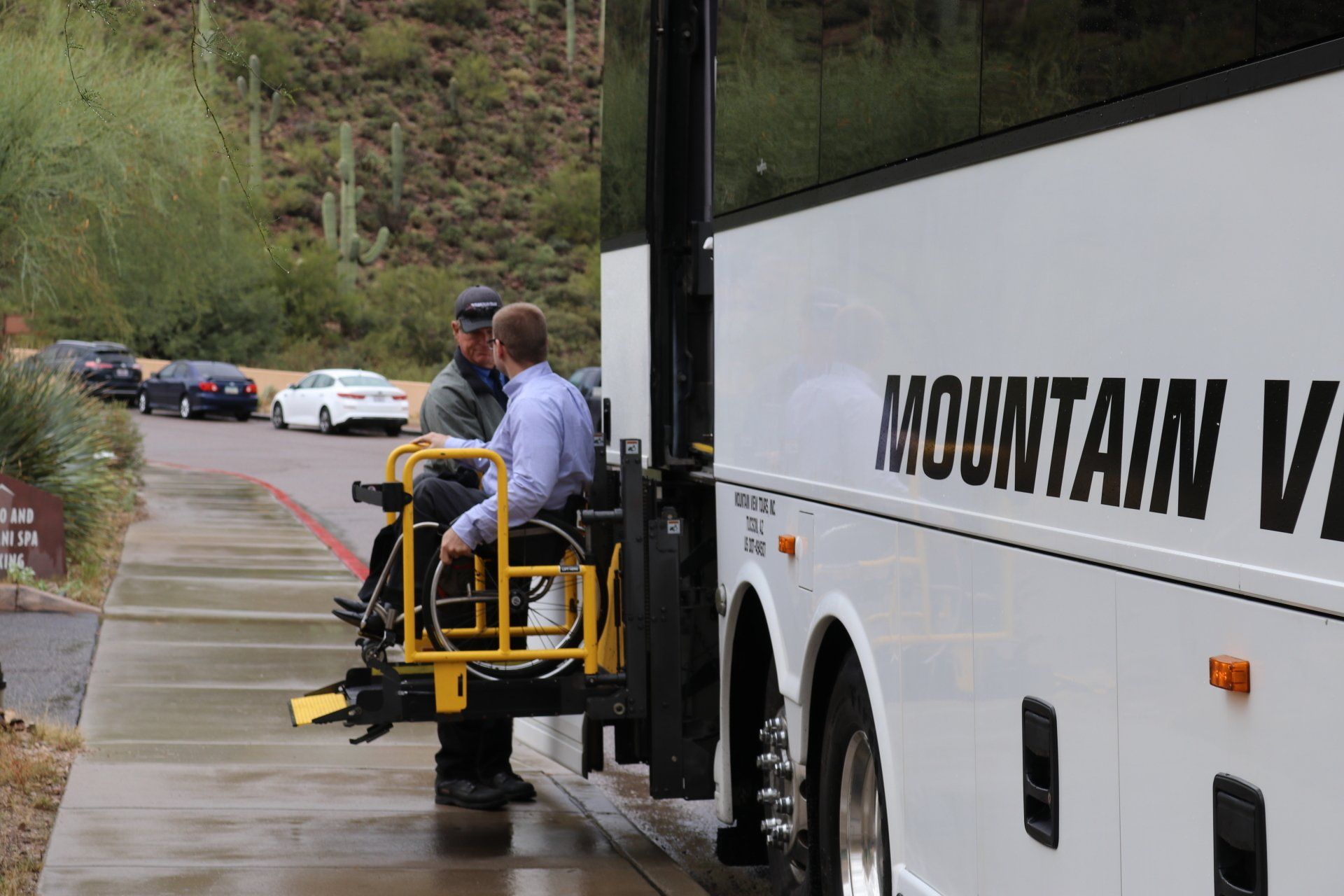 Fleet — Man Beside The Wheelchair Ramp Attached On The Bus In Tucson, AZ