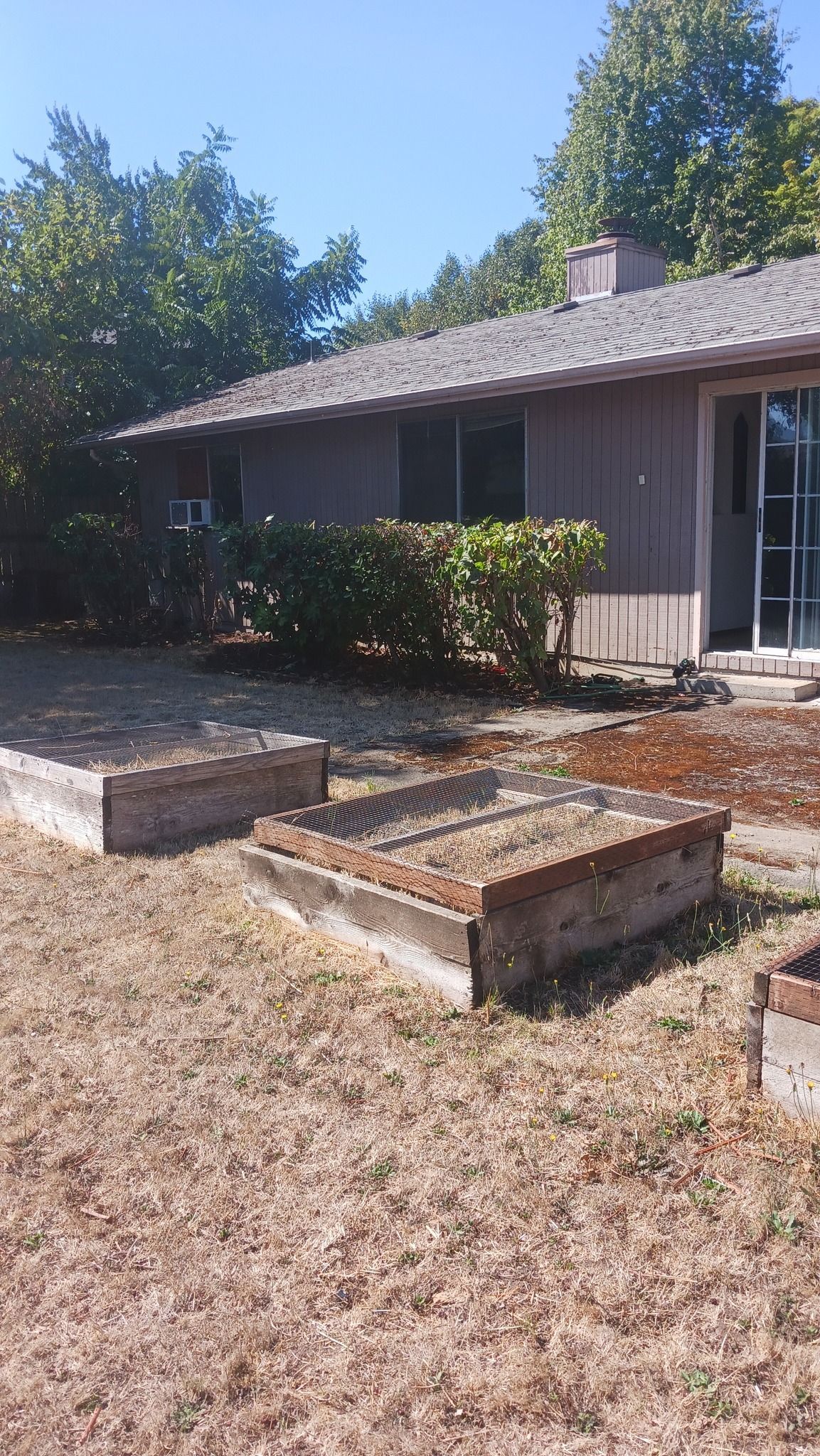 A house with a lot of dirt in front of it.