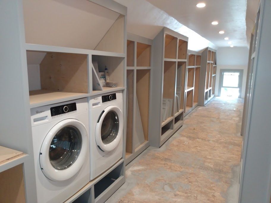 A laundry room with a washer and dryer in it