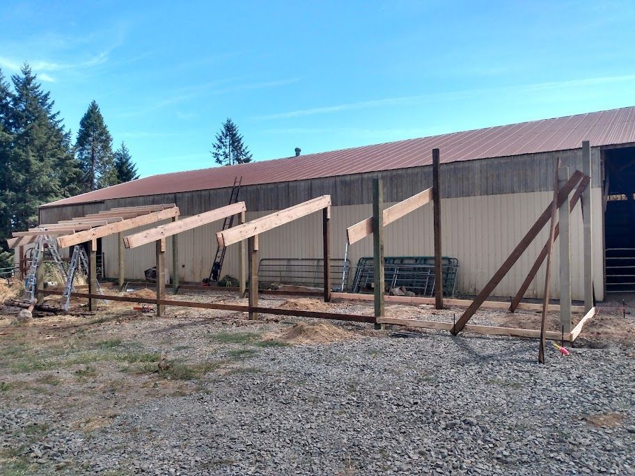 A wooden structure is being built in front of a building.