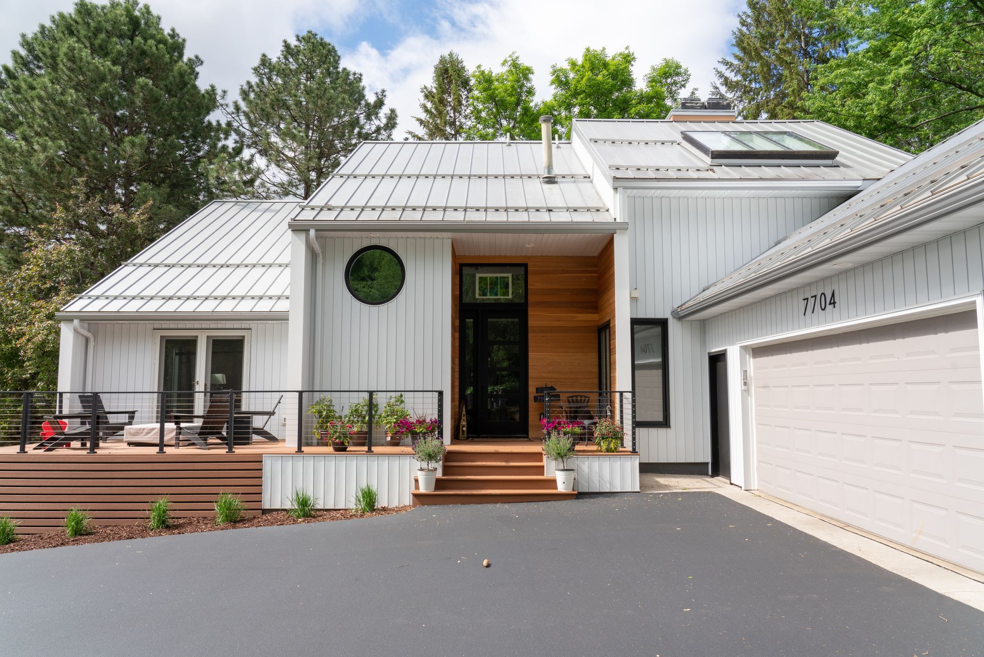 Picture of a home with seamless gutters for its metal roof.