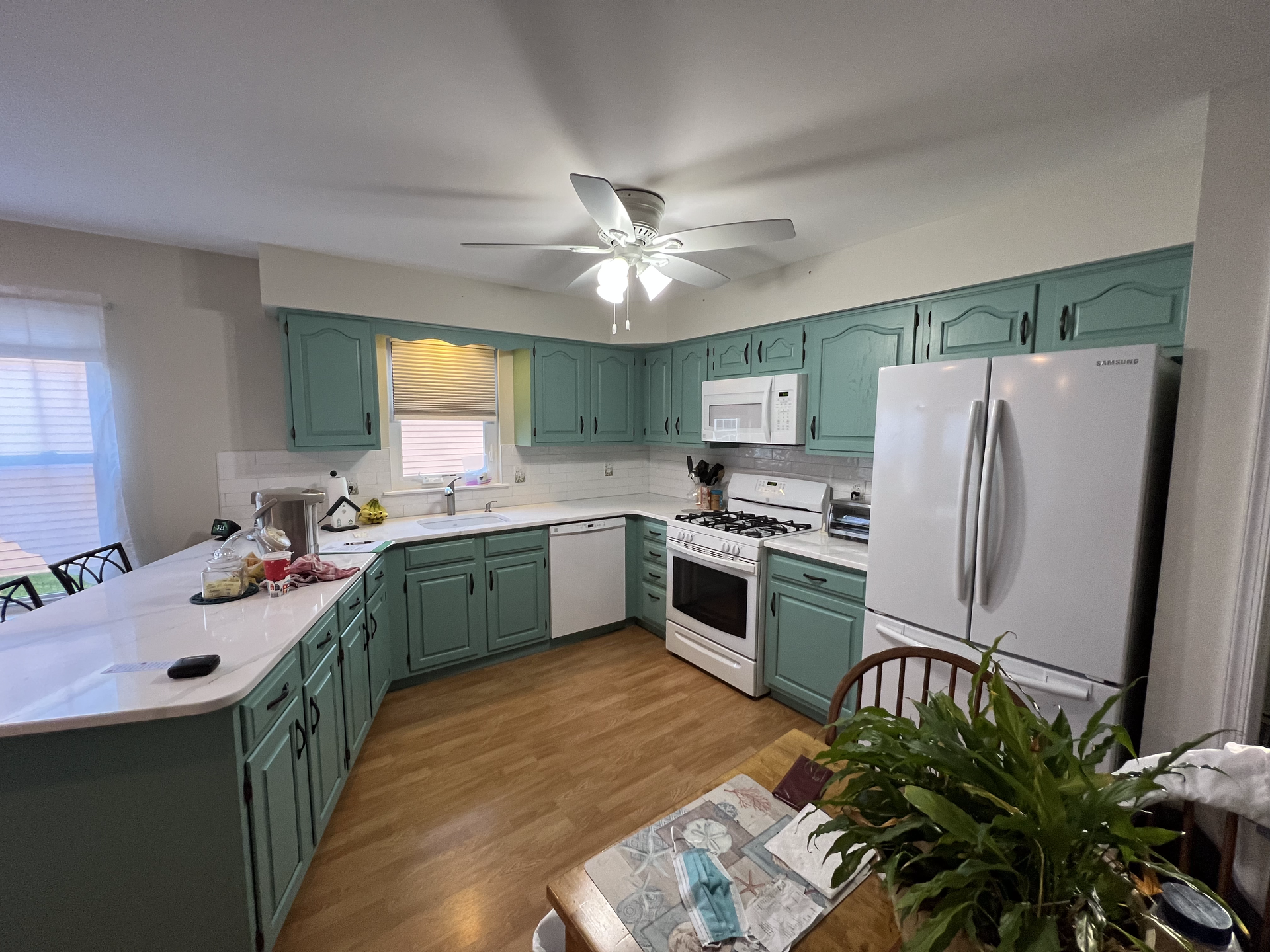 A refinished seafoam green beach kitchen we completed in New Jersey
